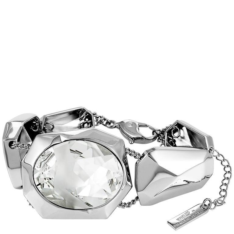 This Atelier Swarovski bracelet is designed by Jean Paul Gaultier and embellished with crystal. The bracelet weighs 55.9 grams and measures 6.50â€ in length. Offered in brand new condition, this item includes the manufacturerâ€™s box.
