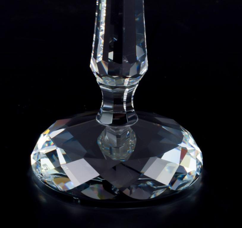 Late 20th Century Swarovski, Austria. A pair of candle holders in faceted crystal. For Sale