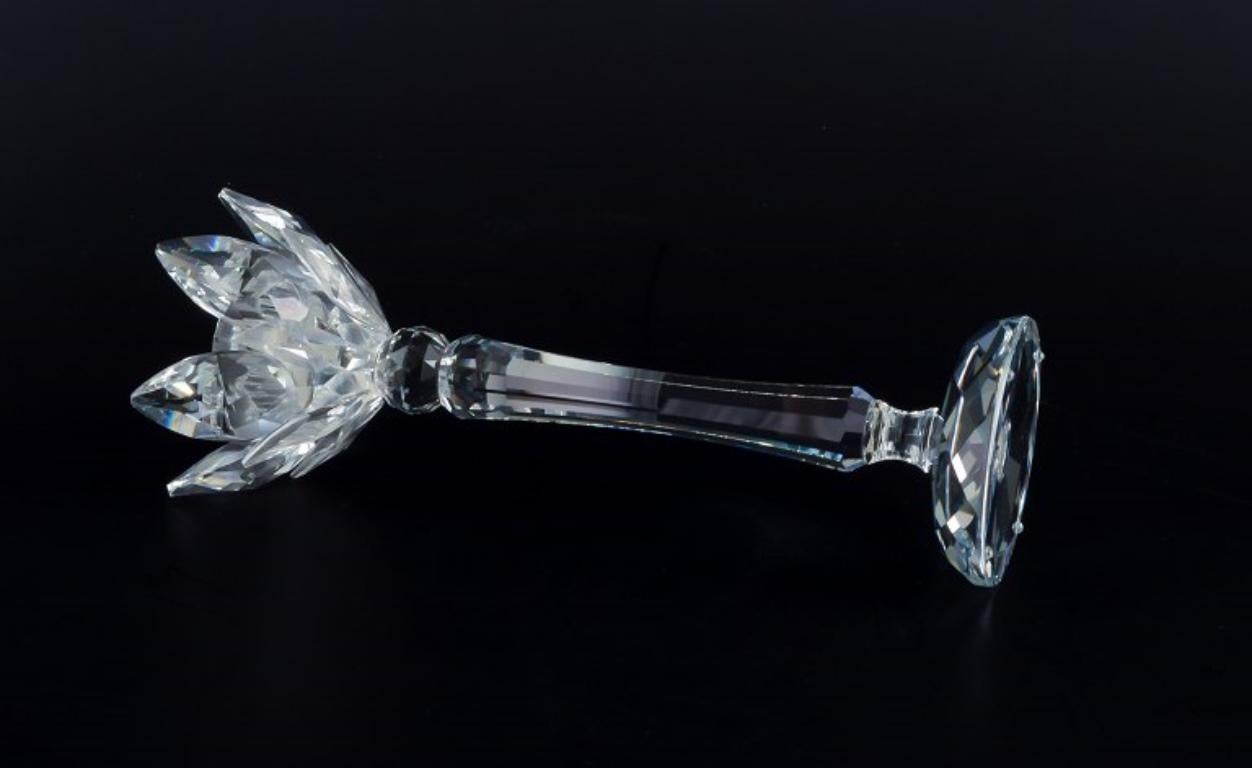Crystal Swarovski, Austria. A pair of candle holders in faceted crystal. For Sale