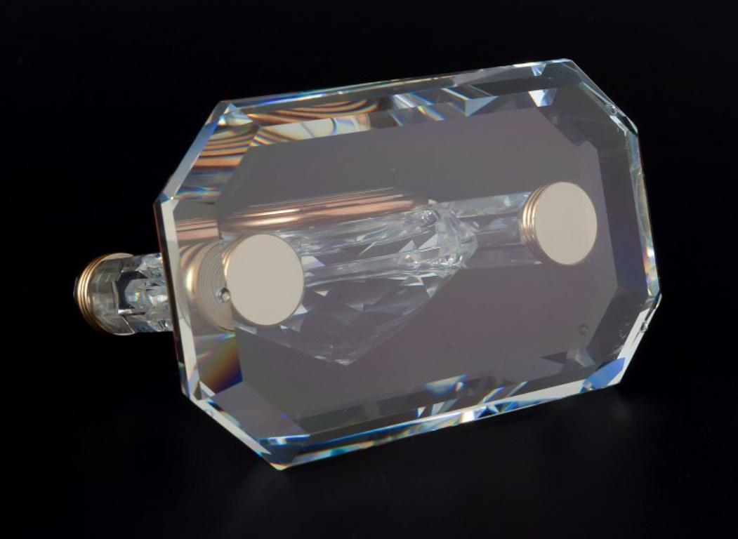 Late 20th Century Swarovski, Austria. Small alarm clock in faceted crystal. Circa 1970s.