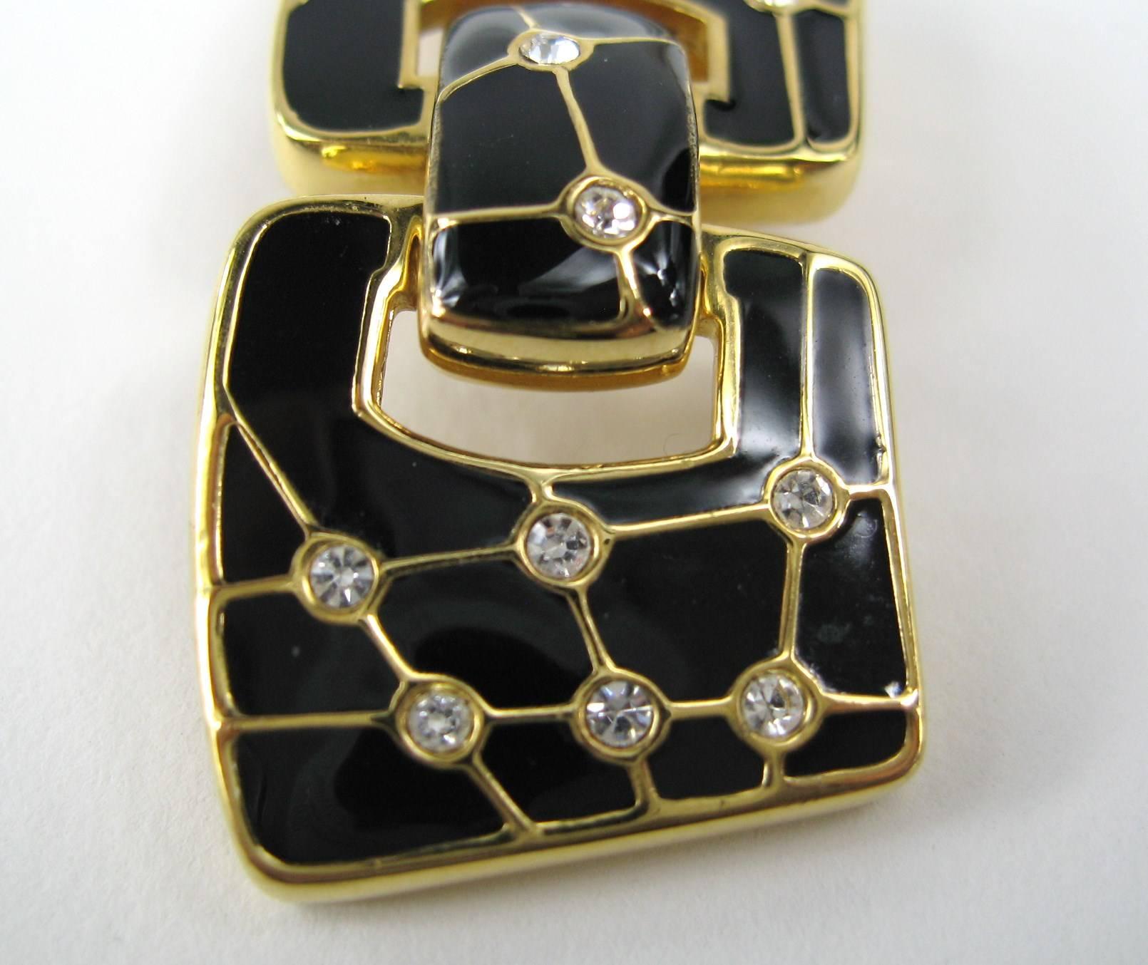 Black enameled Swarovski Enameled crystal dangle Clip on  earrings Measuring  1.70 in x .70 in. This is out of a massive collection of Hopi, Zuni, Navajo, Southwestern, sterling silver, costume jewelry and fine jewelry from one collector. Be sure to