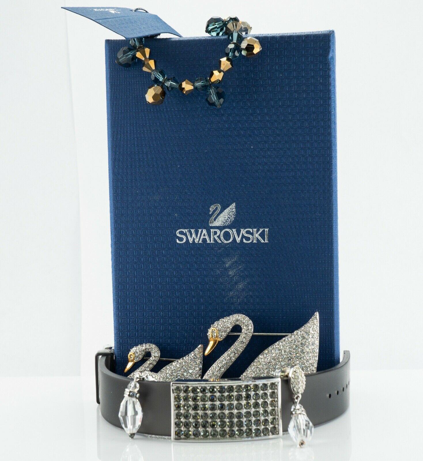 Swarovski Bracelets Swan Brooches Earrings Authentic Lot Box

This lot is for authentic Swarovski jewelry: two brooches or pins, two bracelets, and earrings. Two swans are different in size, one is 2.25