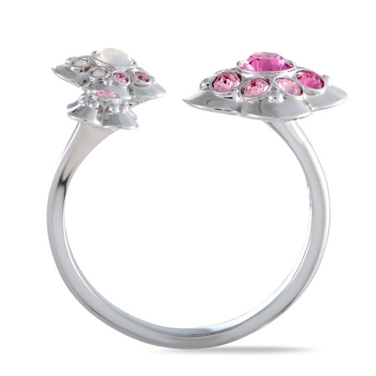 Add a gorgeously feminine touch to your ensembles with this delightful ring that boasts a stylishly offbeat design topped off with alluring clear and pink crystals. The ring is presented by Swarovski and it weighs 3.4 grams. Ring Top Dimensions: