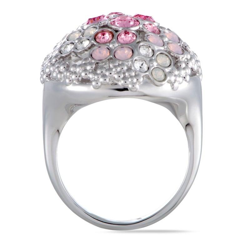 Beautifully decorated with a sublime blend of lovely pink crystals and sparkling clear crystals, this wonderful jewelry piece will add a fashionable touch to any ensemble of yours. The ring is a Swarovski design and it weighs 10.7 grams. Ring Top