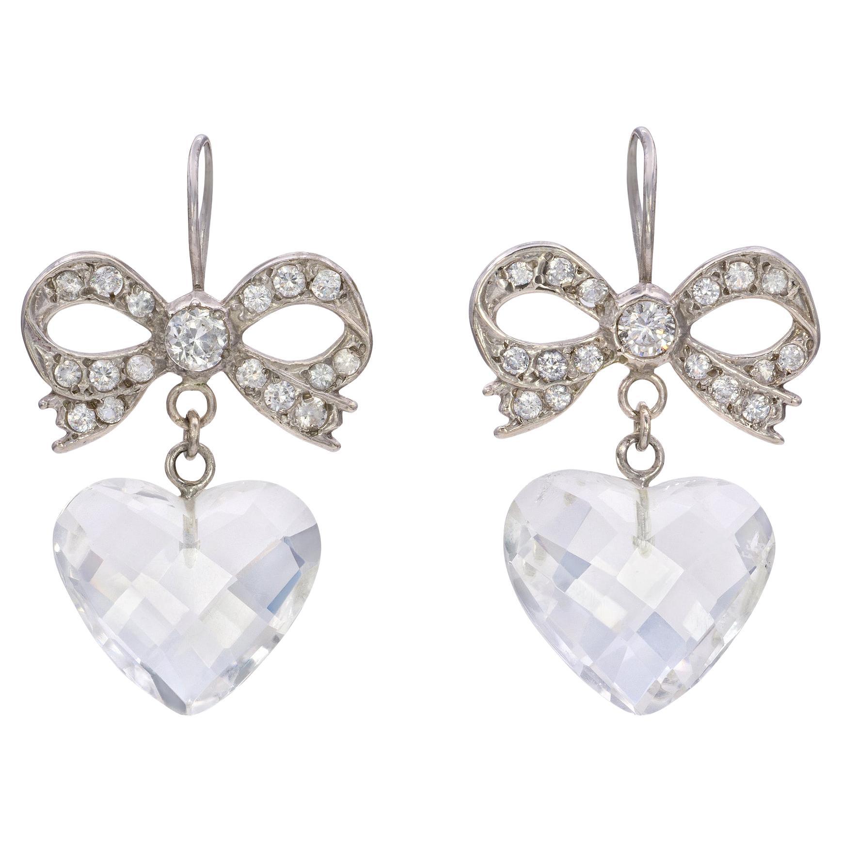        L'amour est en l'air Boucles d'oreilles noeud et coeur en cristal Swarovski en vente