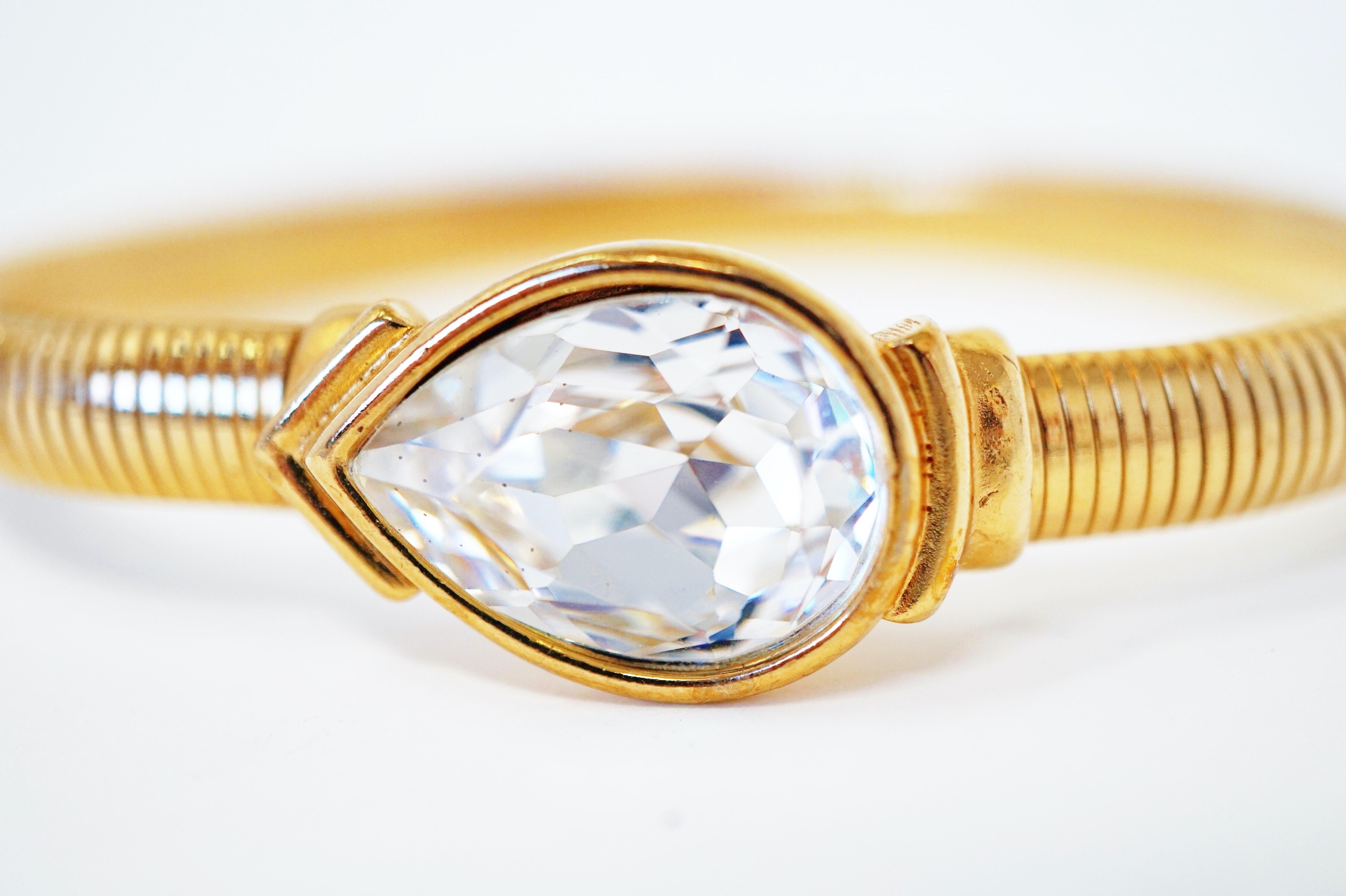 This gorgeous 1980's Trifari bracelet is a wonderful addition to your costume jewelry collection. This easy-to-wear piece features a large faceted pear shaped Swarovski crystal and is a great way to add some sparkle and personality to your everyday