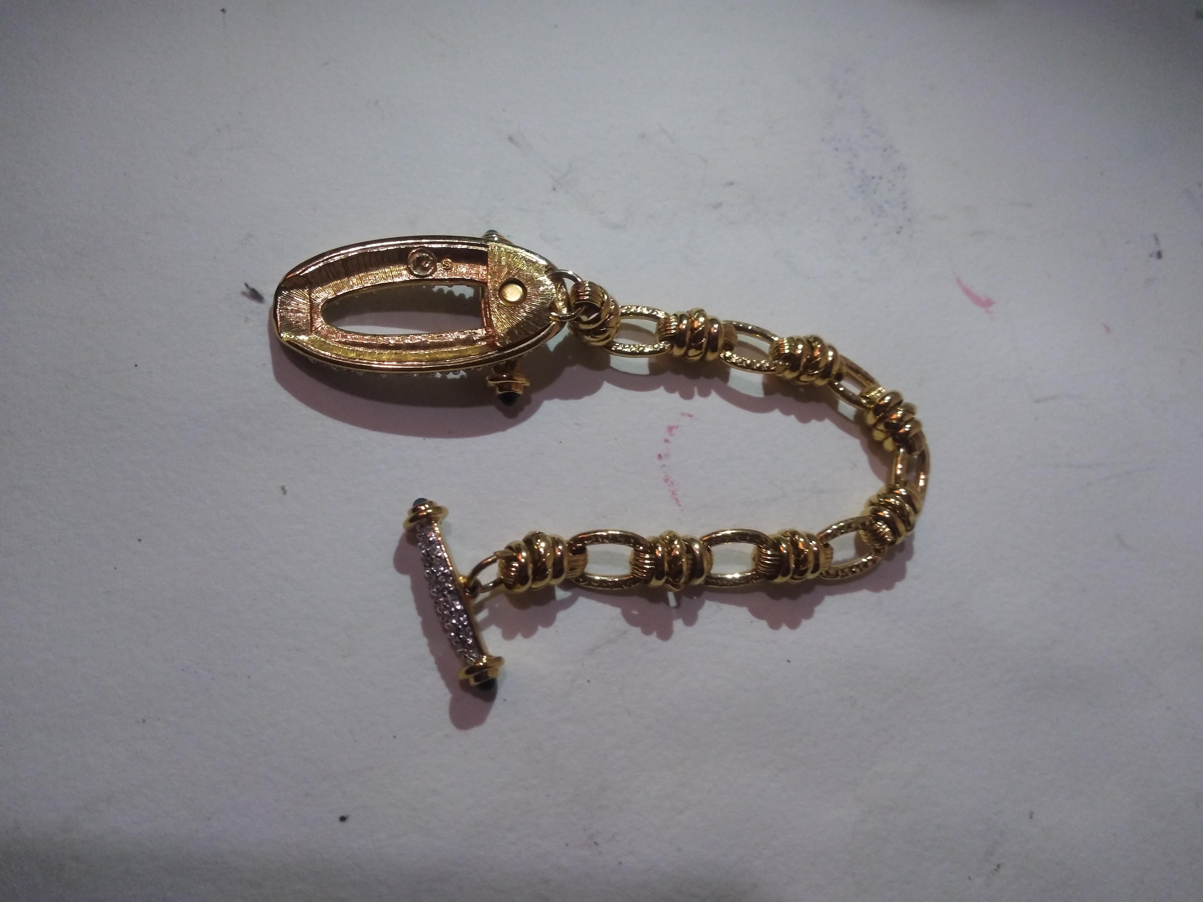 This is a beautiful bracelet by Swarovski. The metal is gold toned and the crystals are Swarovski. The clasp is made of Swarovski crystals and locks into the face of the bracelet.
Perfect for a night on the town.
