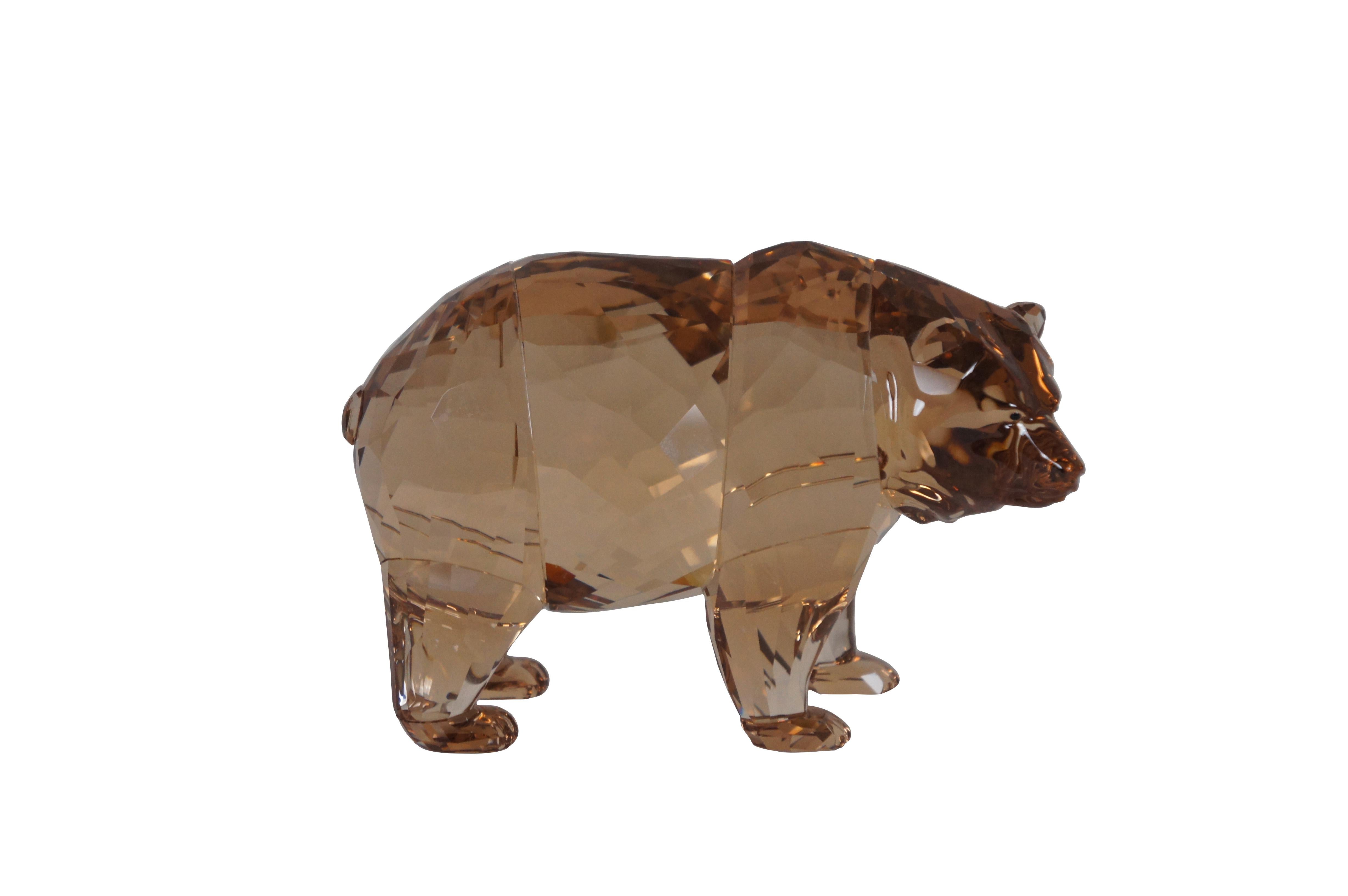 Swarovski Collectors Society 2017 Annual Edition, Arcadia. Golden brown crystal figurine in the shape of a bear with black eyes. Includes Certificate of authenticity and original packaging. Made in Serbia.

Dimensions:
5