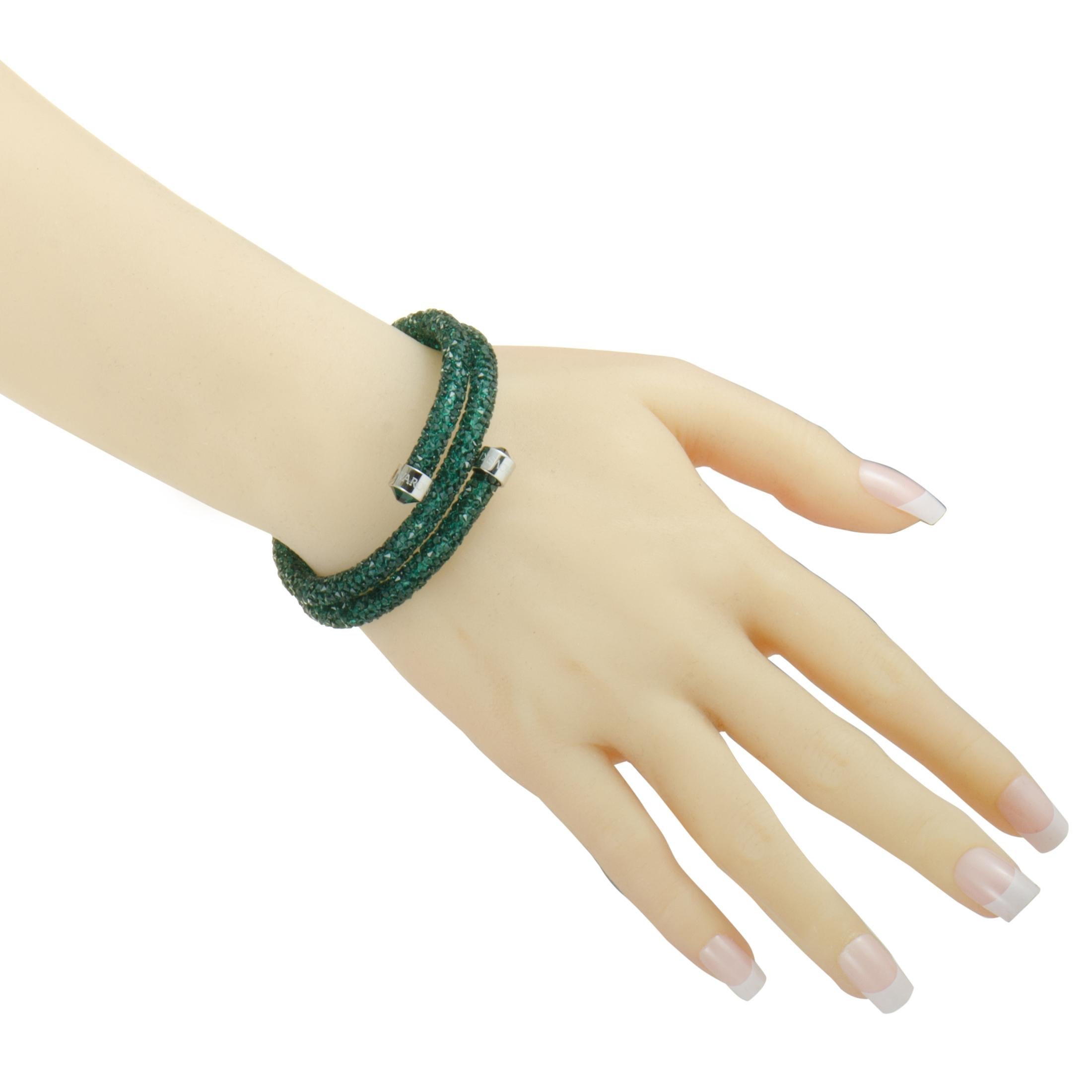 The “Crystaldust” bracelet by Swarovski is embellished with a plethora of green crystals and weighs 22 grams, measuring 7.00” in length (size M).
 
 This item is offered in brand new condition and includes the manufacturer’s box.
