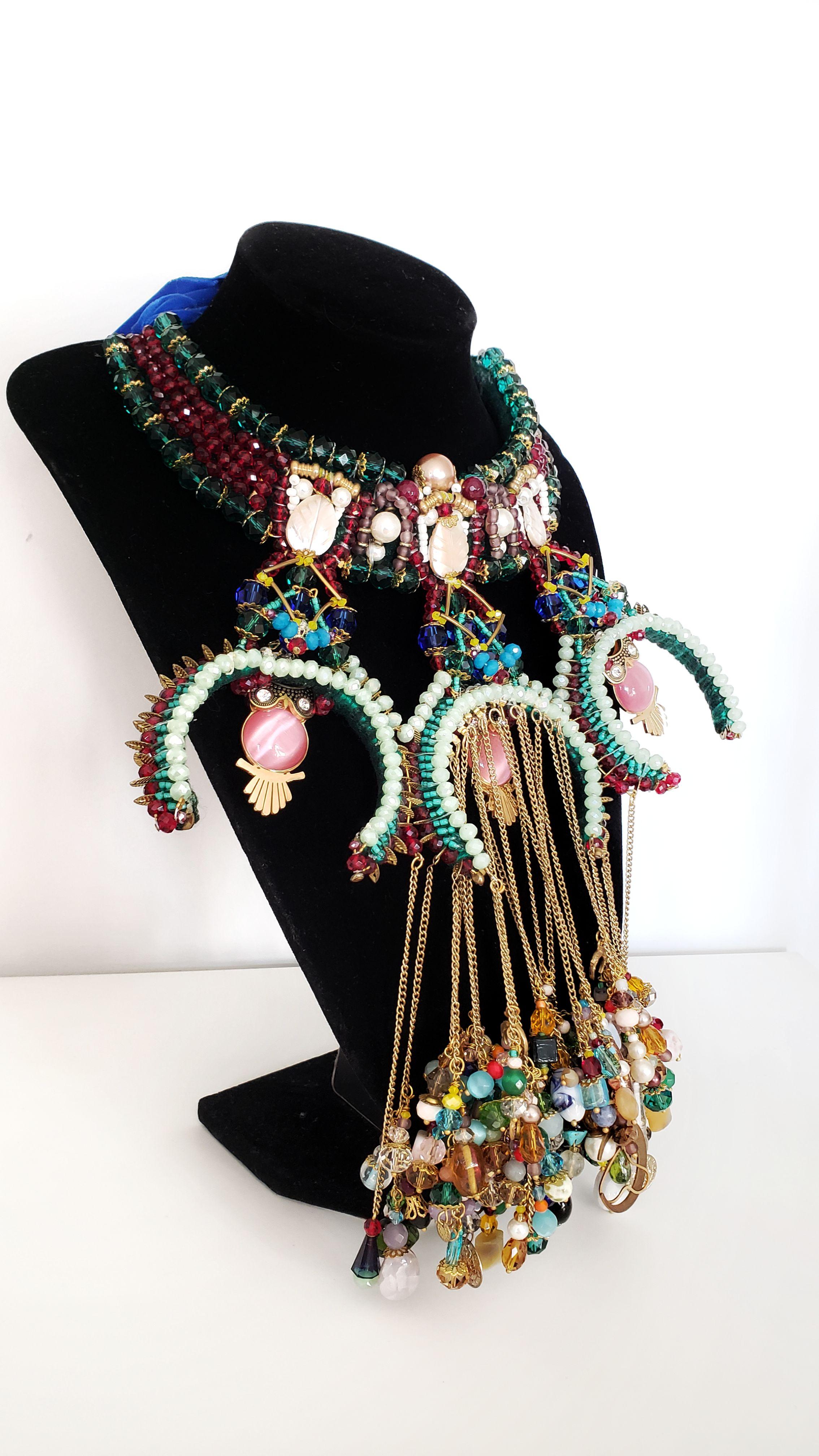 A striking combination of glamour and sophistication, this elegant one-of-a-kind handmade beaded embellished chain tassel bib collar necklace is a spellbinding statement and befitting companion for any night-time look.
Handcrafted with three owls