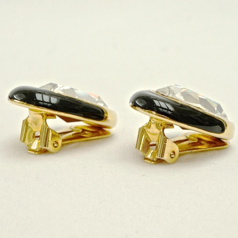Swarovski beautiful gold plated and black enamel clip on earrings, set with lovely oval faceted crystals. Length 2.4cm / .94 inches by width 1.7cm / .67 inch. The earrings are in very good condition, and will arrive in their original box.

These