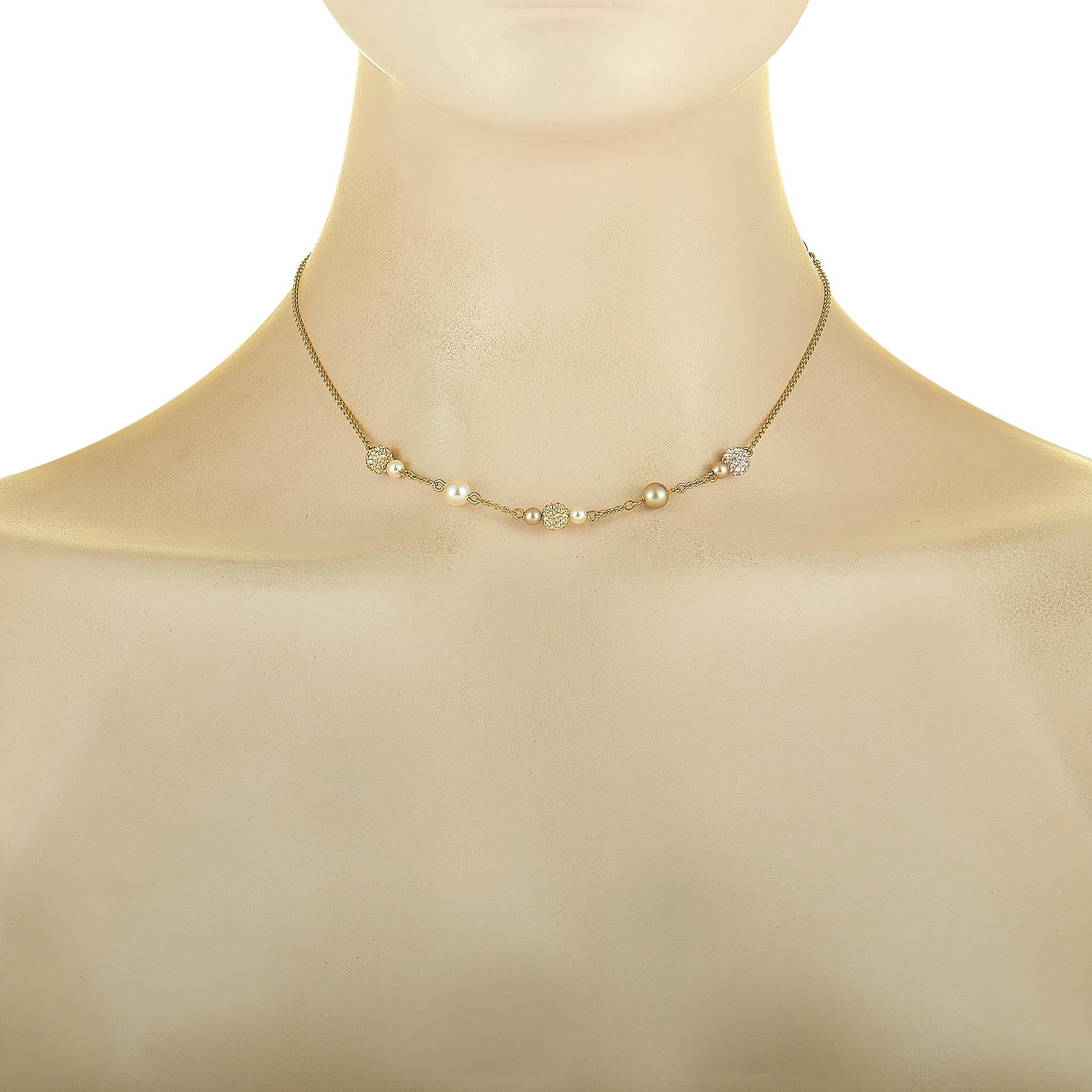 The Swarovski “Lady Jane” necklace is crafted from 23K yellow gold-plated stainless steel and decorated with Swarovski crystals and crystal pearls. The necklace weighs 5.5 grams and measures 16” in length.