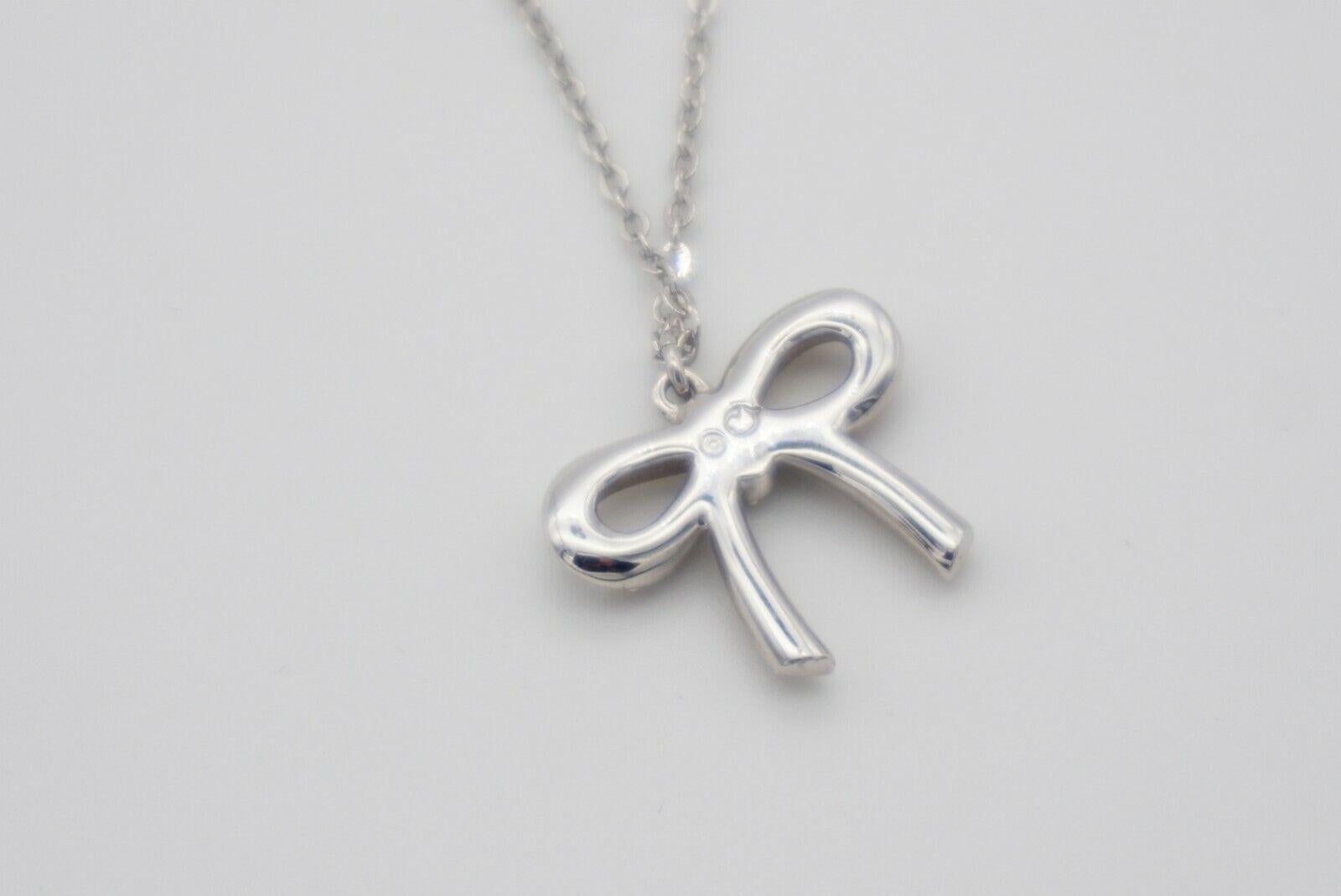Swarovski Lifelong Knot Bow Crystals Pendant Cute Elegant White Silver Necklace For Sale 4