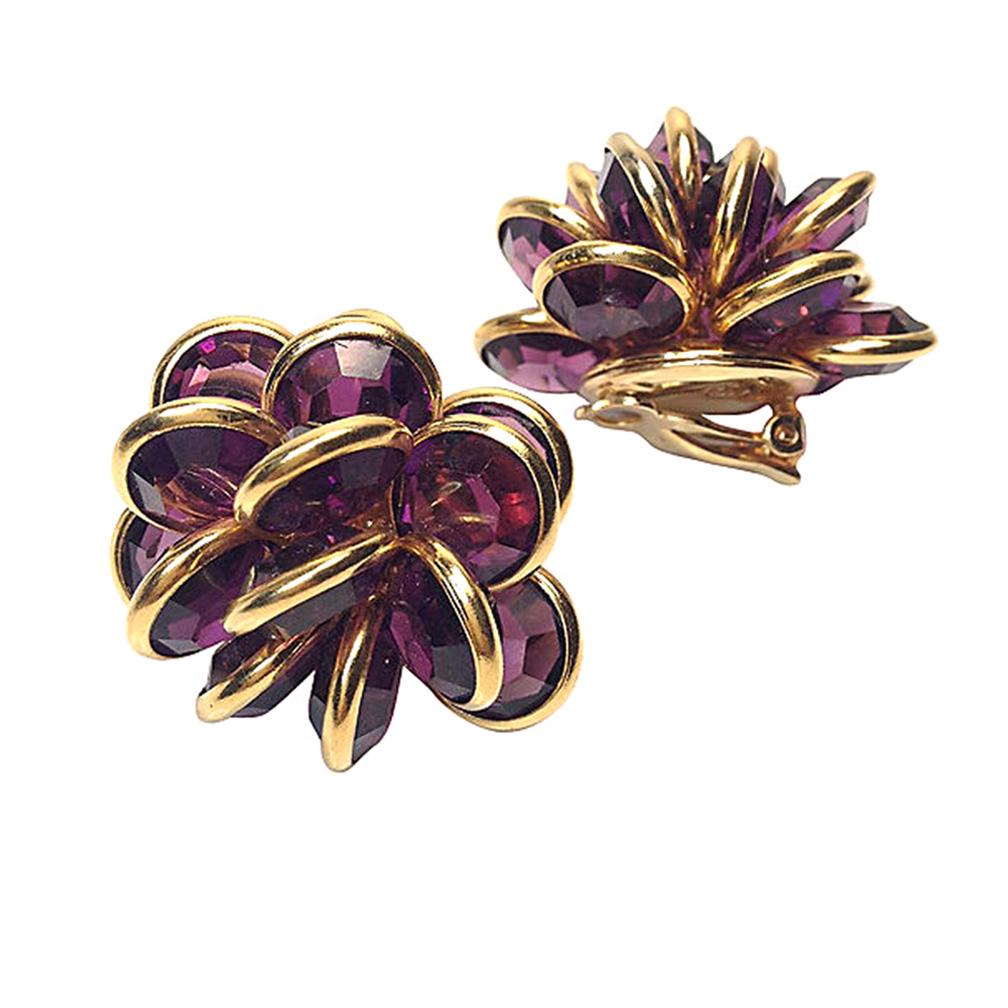 This is a pair of Swarovski purple crystal cluster clip-on earrings. They are made with rich 18K gold plate. Each has fifteen pieces of 10 mm purple faceted crystal glass stones bezel set to form a big cluster. They are marked with the Swarovski