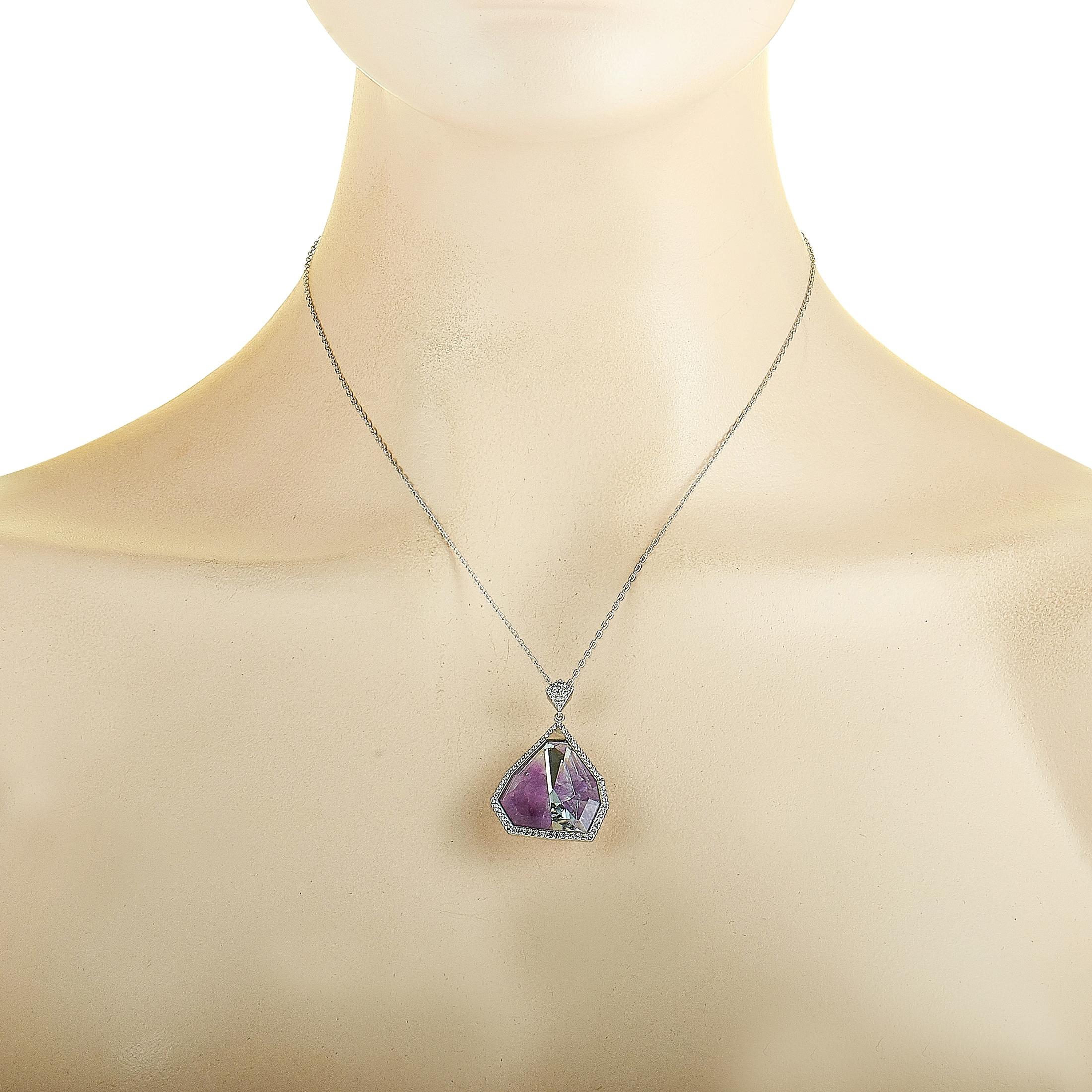 This Swarovski necklace is crafted from rhodium-plated stainless steel and decorated with purple and clear Swarovski crystals. The necklace weighs 15.7 grams and boasts an 18” chain and a pendant that measures 1.62” in length and 1” in width.