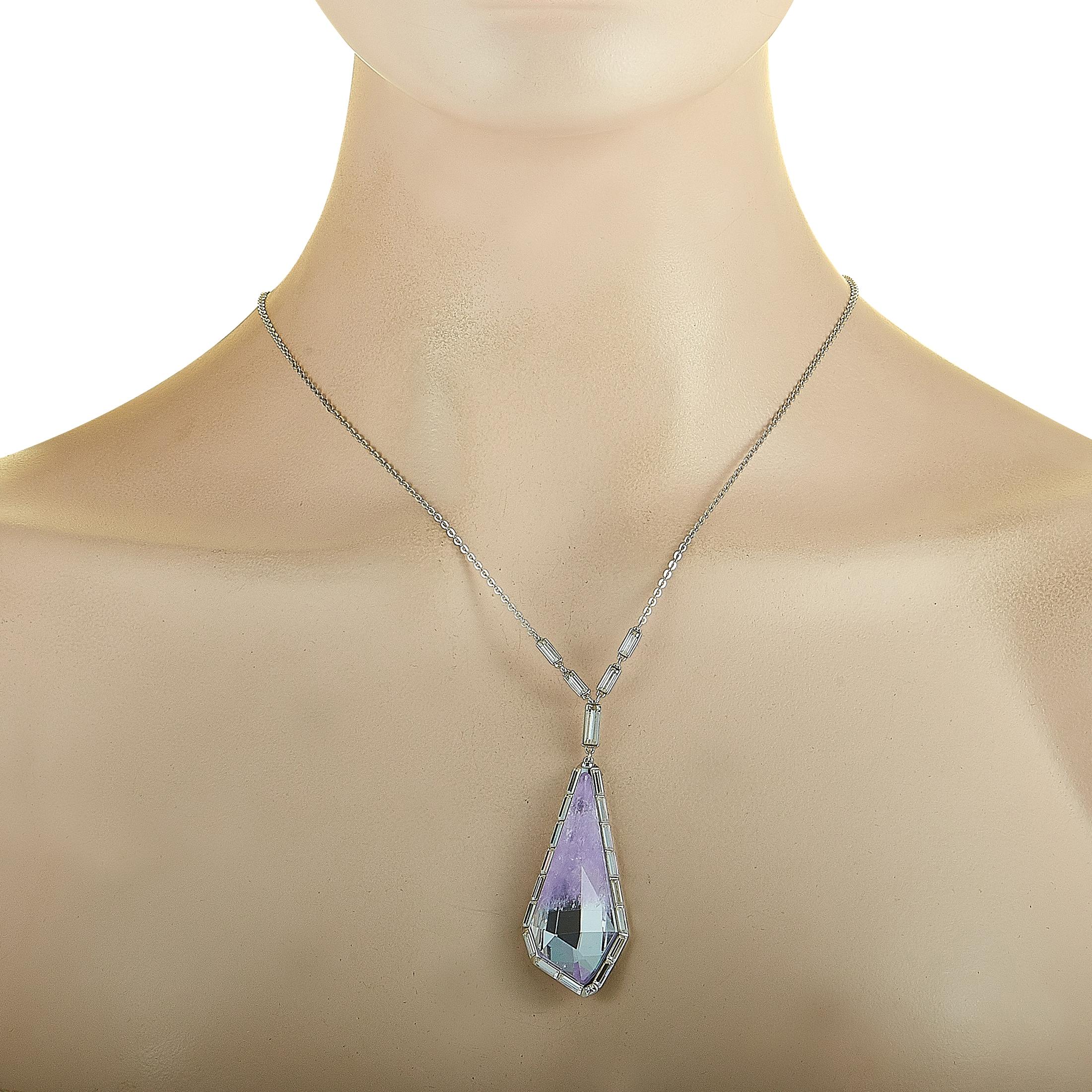 This Swarovski necklace is made of rhodium-plated stainless steel, boasting a 28” chain with lobster claw closure and a pendant that measures 2.50” in length and 0.87” in width. The necklace is decorated with purple and clear Swarovski crystals.