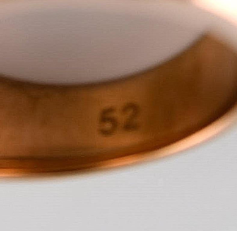 Modern Swarovski signet ring in gold tone adorned with smoky quartz. For Sale