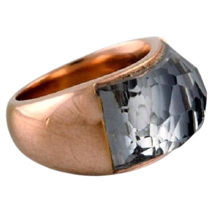 Swarovski signet ring in gold tone adorned with smoky quartz.