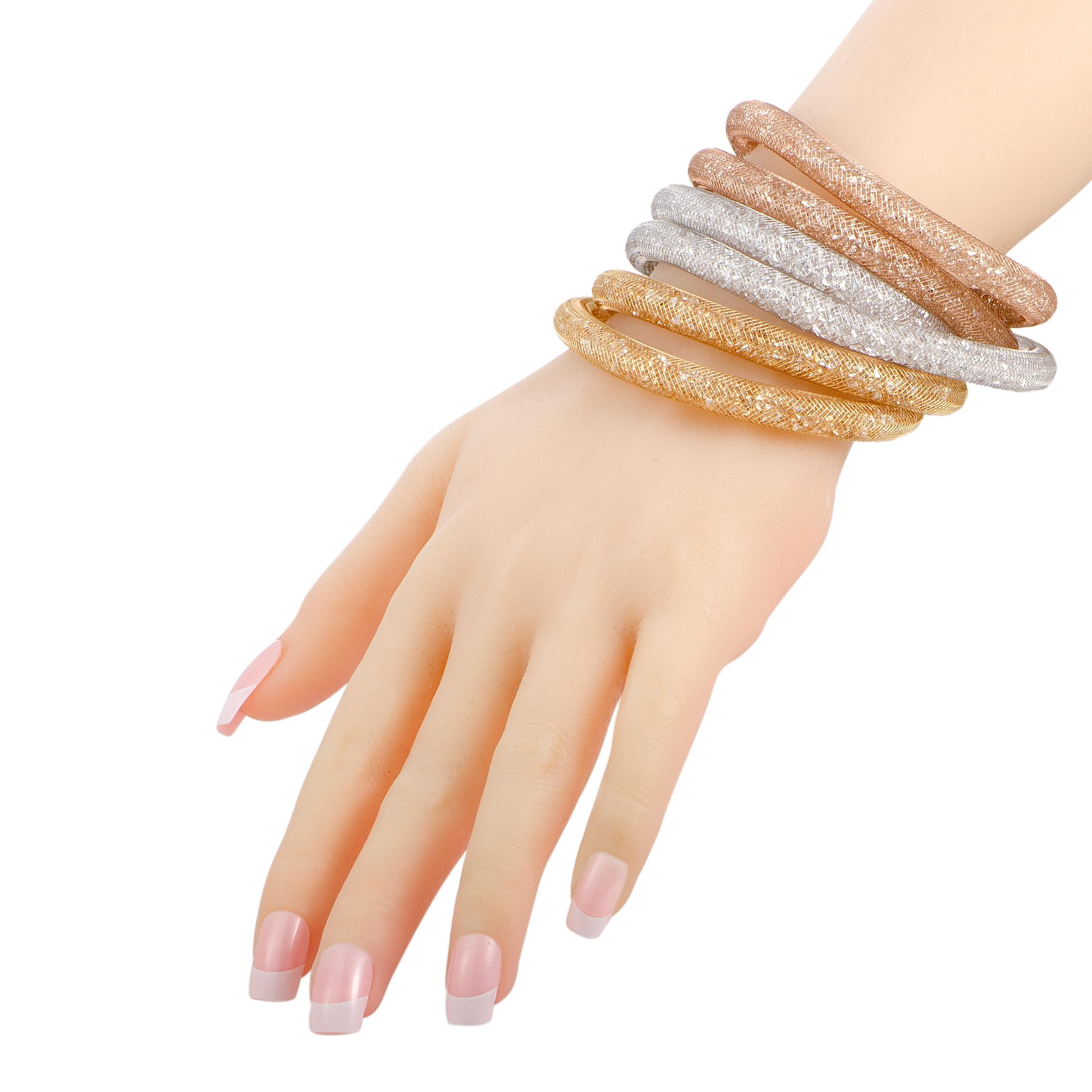 The Swarovski “Stardust Deluxe” bracelet set includes three bracelets that are presented in rose, white, and yellow gold tone. The bracelets measure 16.00” in length and boast fishnet tubes filled with crystals. Each bracelet weighs 34.5 grams, for