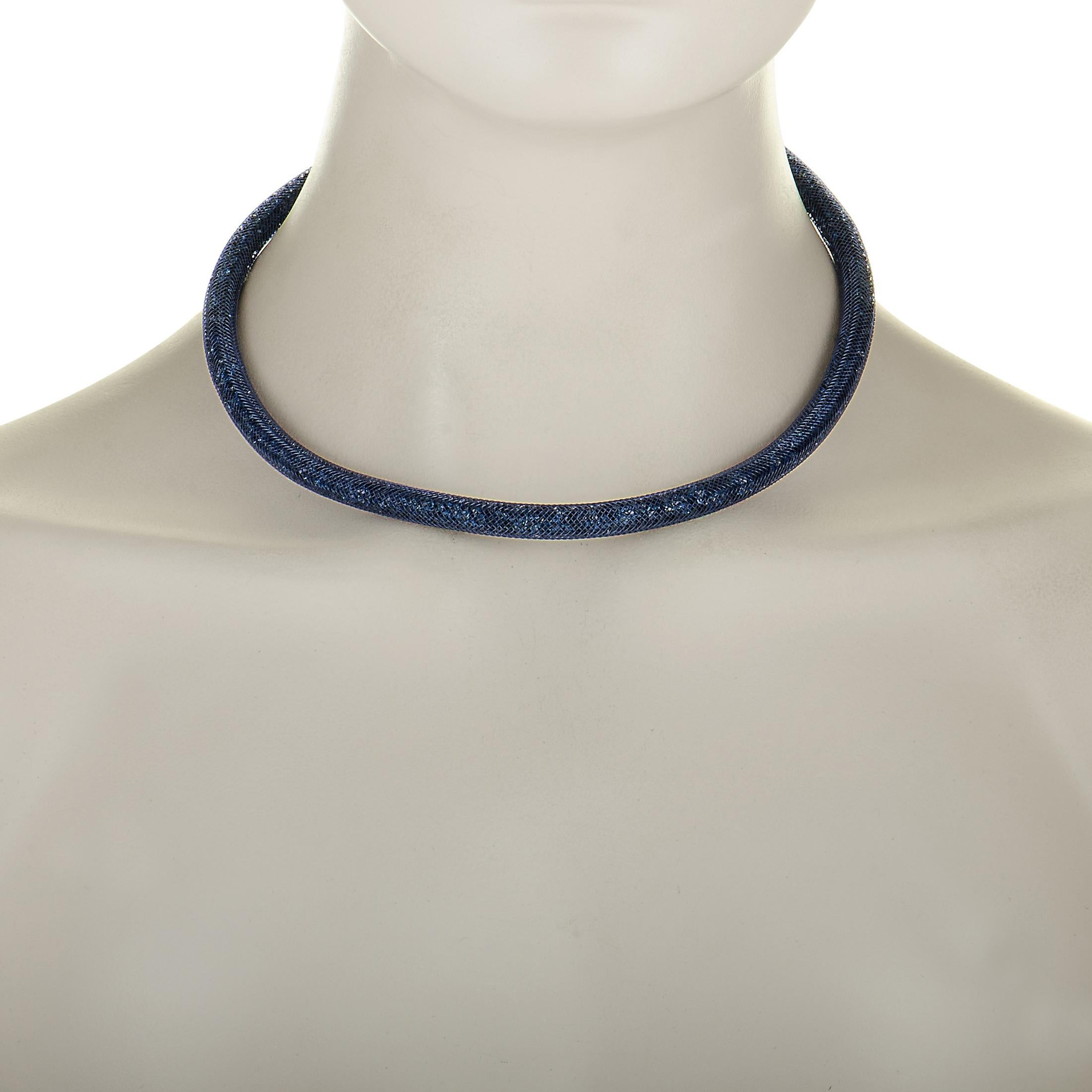 The Swarovski “Stardust” necklace is made out of palladium-plated stainless steel and fishnet tubes filled with blue crystals. The necklace weighs 36.7 grams and measures 15.00” in length.
 
 This item is offered in brand new condition and includes
