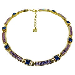 SWAROVSKI swan logo signed gold plated amethyst crystal designer necklace