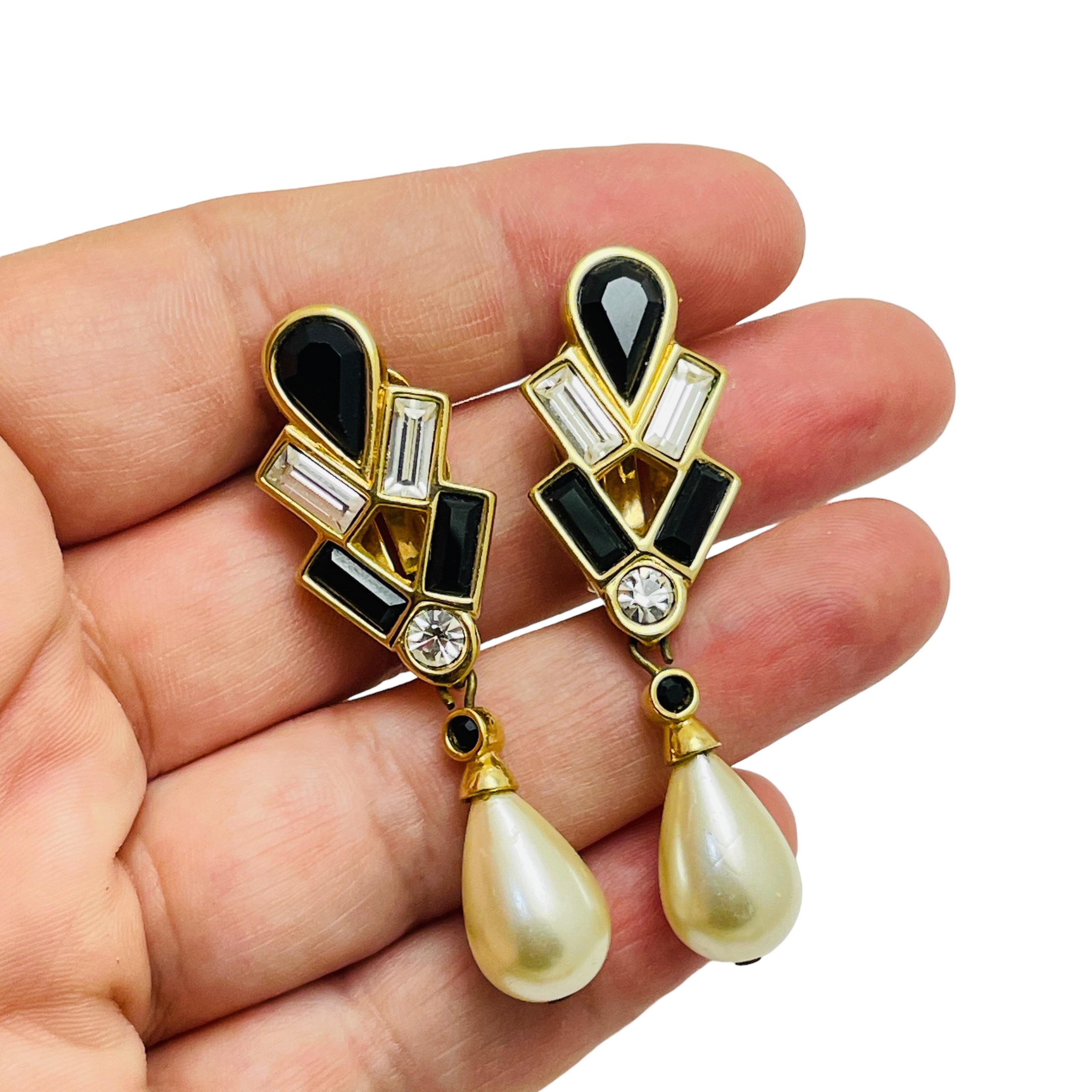 Women's SWAROVSKI swan logo signed gold plated crystals dangle designer clip on earrings For Sale