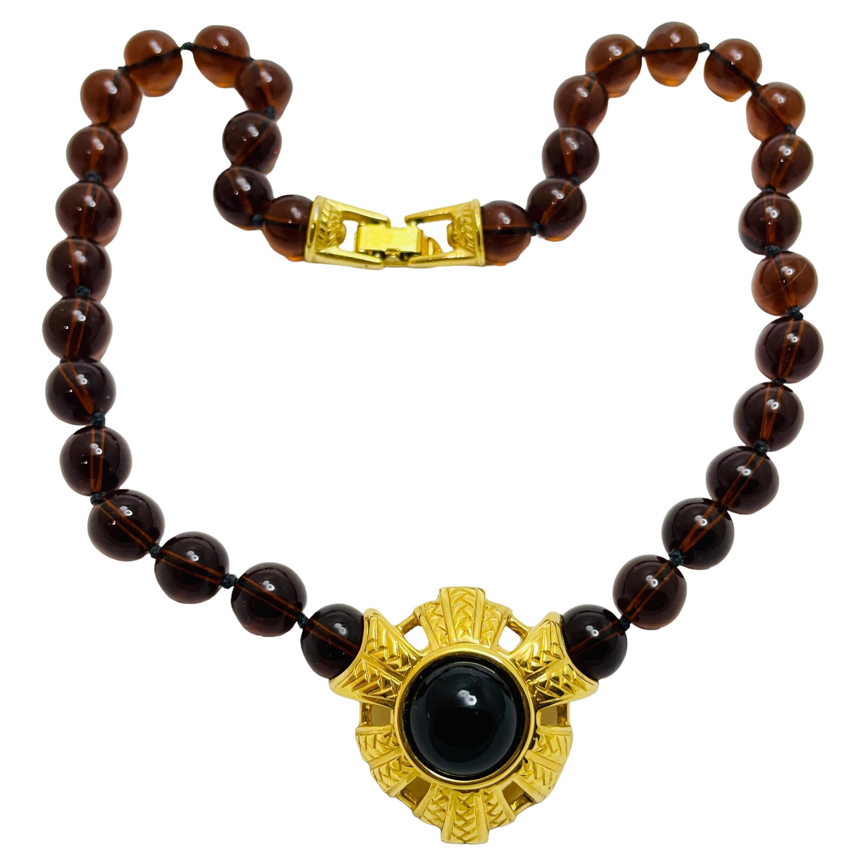Collana firmata SWAROVSKI con perline in vetro dorato in stile etrusco in vendita