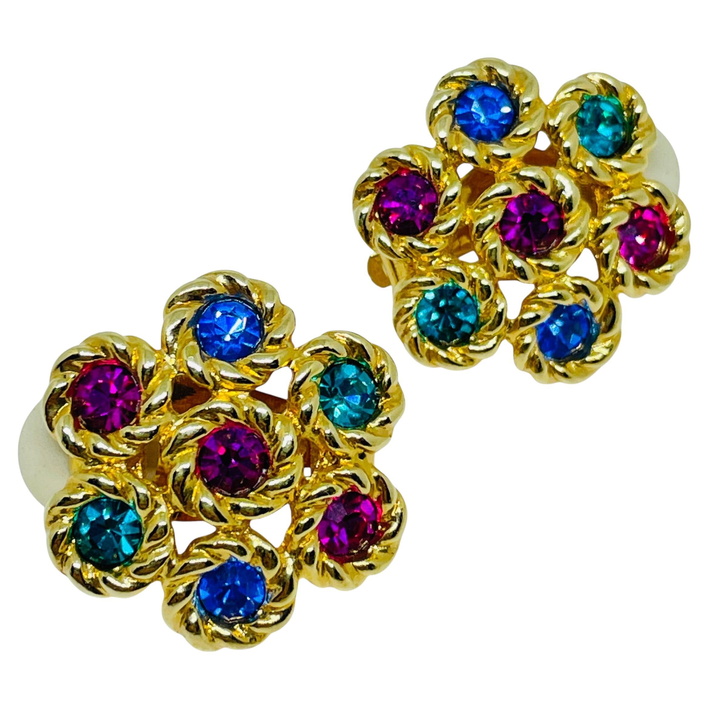 Orecchini a clip firmati Swarovski con fiore in cristalli placcati oro in vendita