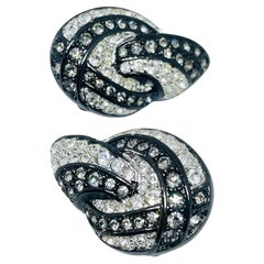 Boucles d'oreilles à clip vintage Swarovski en cristal argenté, ornées d'un cygne, signées par le créateur