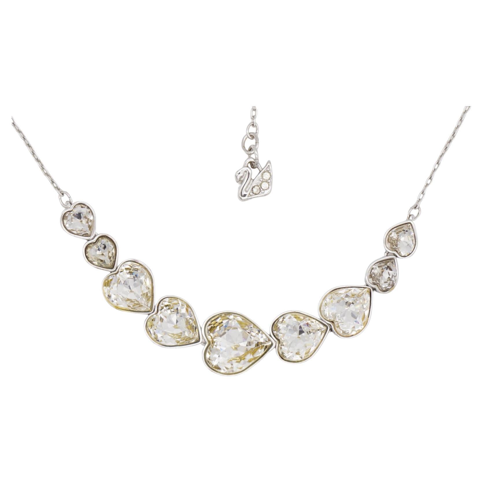 Swarovski Symmetric Nine 9 Hearts Love Clear Crystals Pendant Necklace, Silver Tone

Very good condition and very new. With box. 100% Genuine.

Length: 43 cm. Pendant: 7.5 cm.

_ _ _

Great for everyday wear. Come with velvet pouch and beautiful