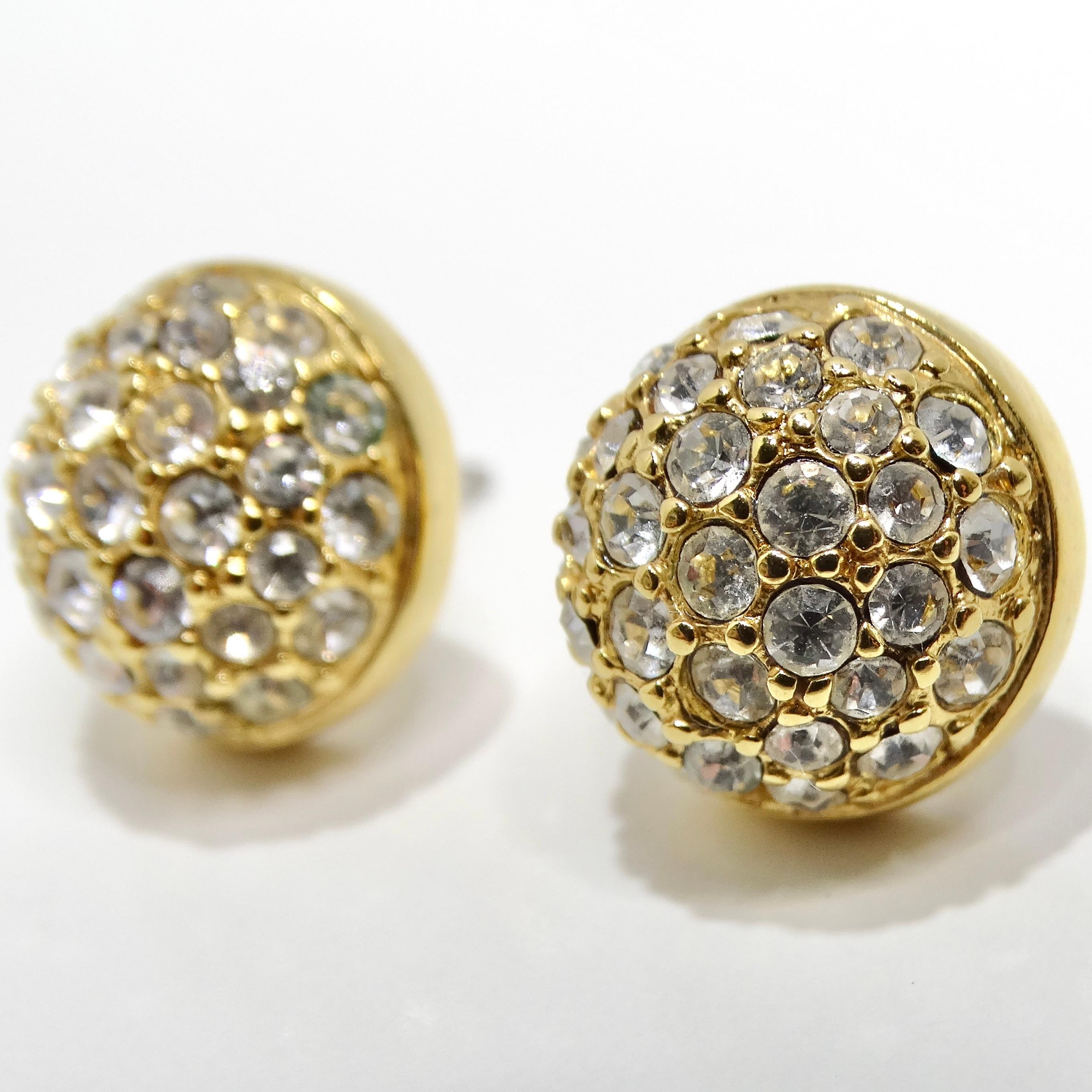 Add a touch of glamour to your ensemble with the Swarovski Vintage 18K Gold Plated Rhinestone Stud Earrings. These exquisite stud earrings from the 1990s feature a timeless ball-shaped design, adorned with clear Swarovski rhinestones that catch the