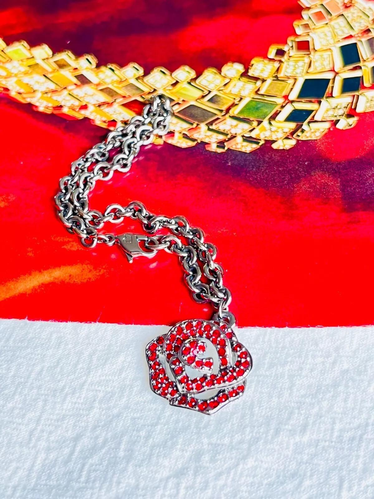 Swarovski Vintage Unisex 3D Vivid Rose Flower Ruby Red Crystals Openwork Pendant Charm Chain Bracelet, Silver Plated

Very excellent condition. Come with original box and tag. 100% Genuine.

Material: Silver plated metal, Rhinestones.

Length 18