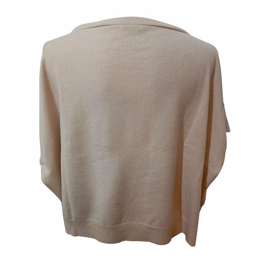 Cashmere Creme white color Inserts in rhodium-plated metal Short sleeves Overfit High Maximum length cm 48 (1889 inches)
