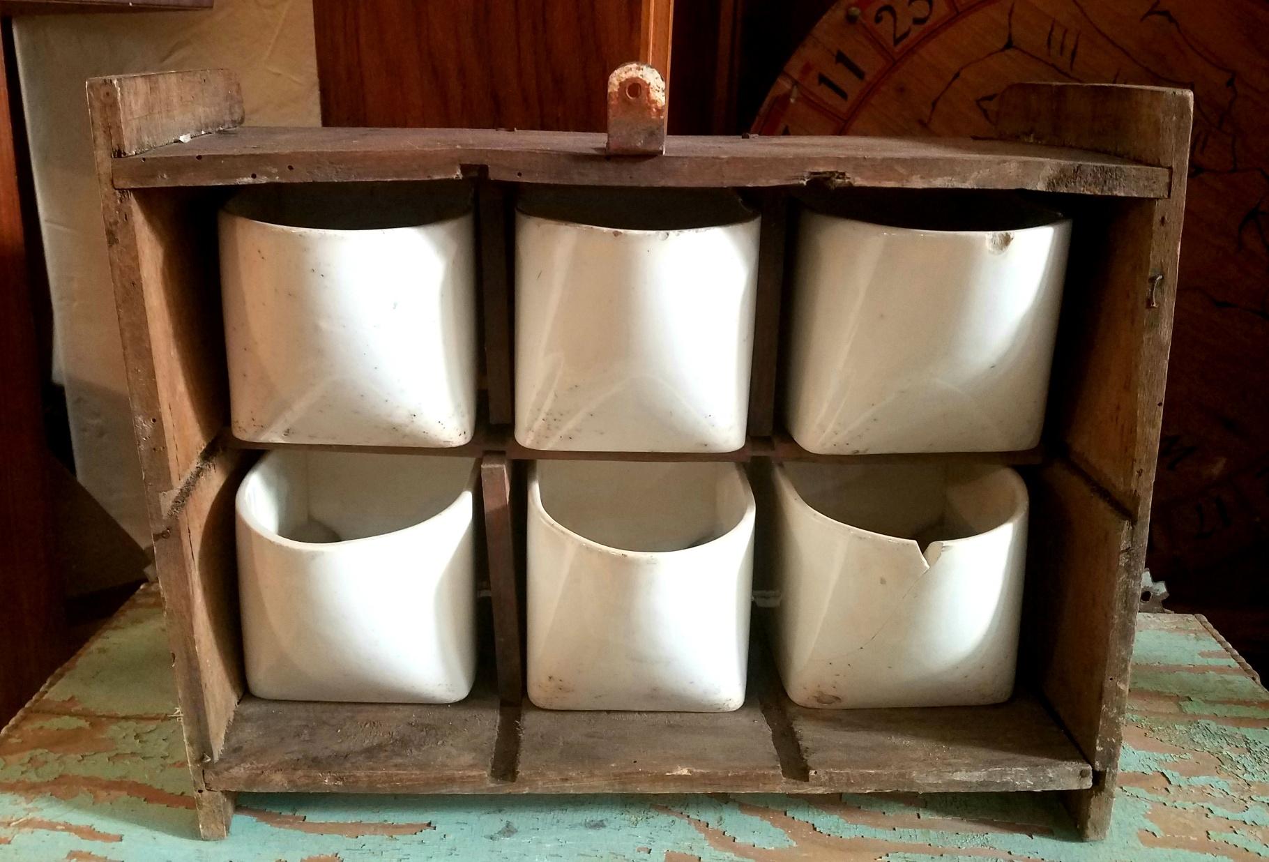 1900s ceramic wall spice rack hand painted and glazed ceramic containers. Original condition. Wood base is hand made.
