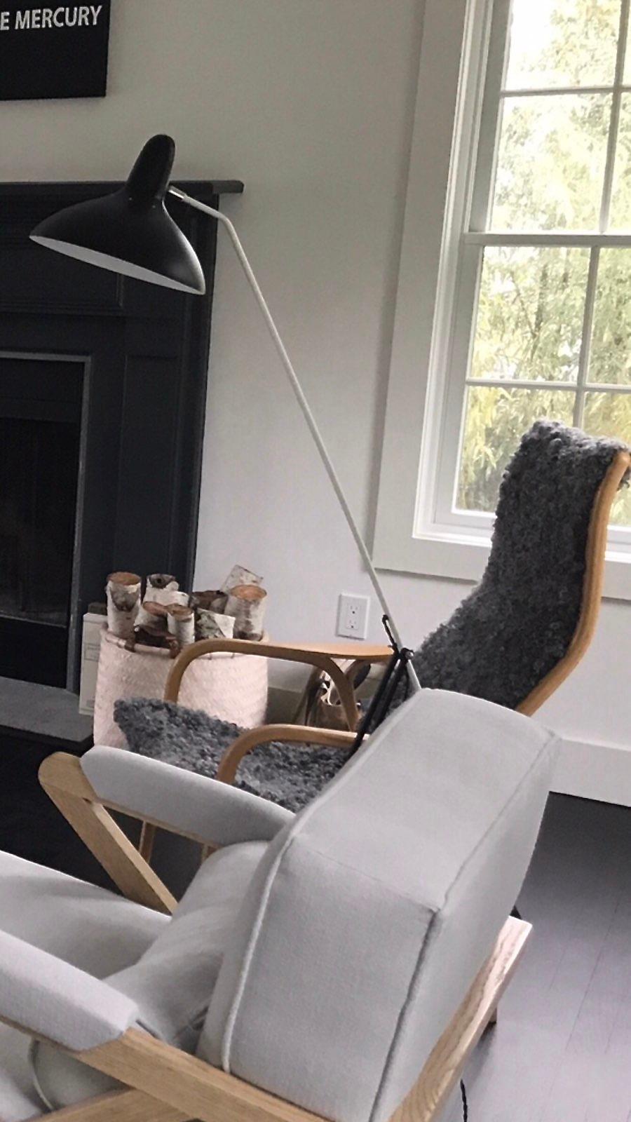 Mid Century Swedish designer Yngve Ekström's Lamino Easy Chair made for Swedese, circa 1960s. The original linen and sheepskin have been replaced with new upholstery linen and soft curly sheepskin from Gotland, Sweden. The body of the chair is