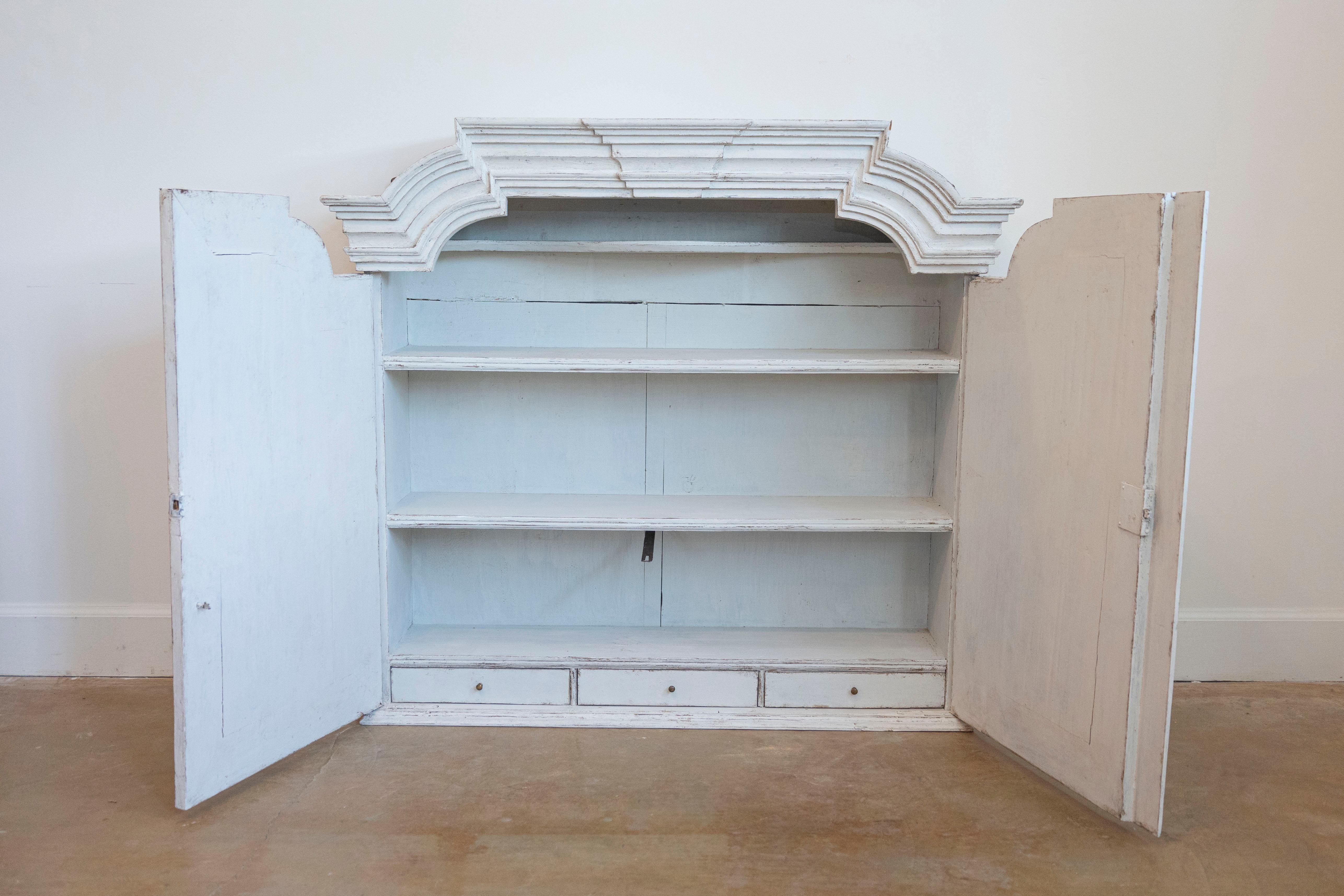 Carved Swedish 1770s Rococo Painted Wall Cabinet with Chapeau de Gendarme Style Cornice