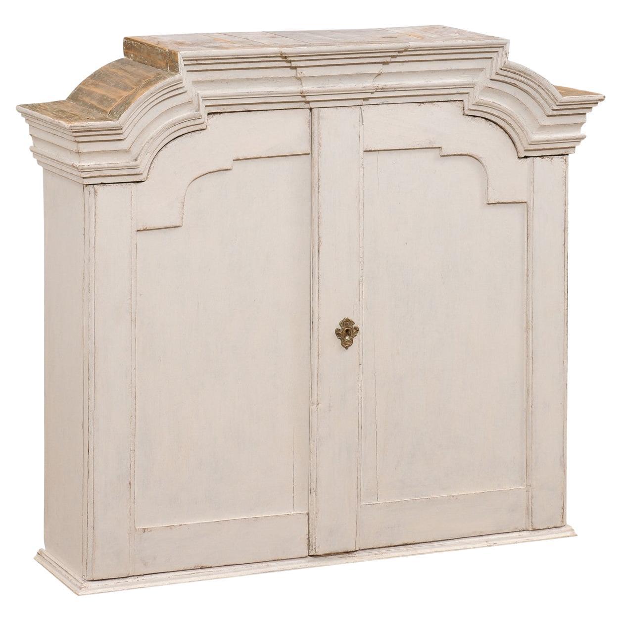 Swedish 1770s Rococo Painted Wall Cabinet with Chapeau de Gendarme Style Cornice For Sale