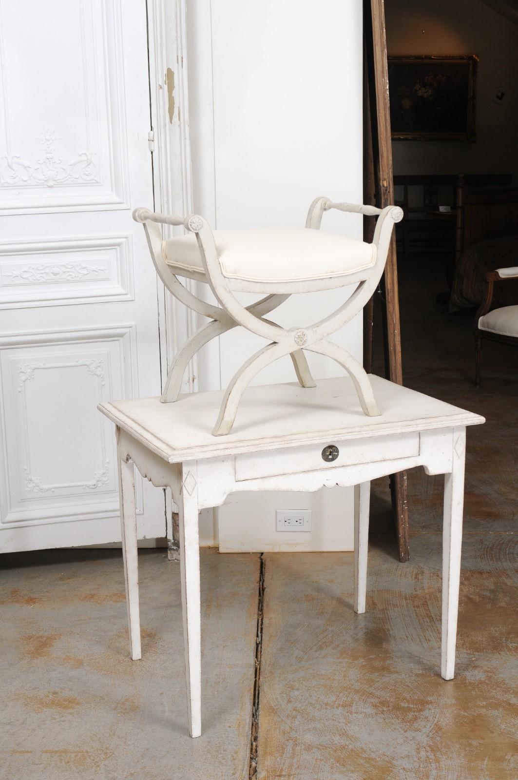 Carved Swedish 1830s Empire Style Painted and Upholstered Stool with Spindle Arms