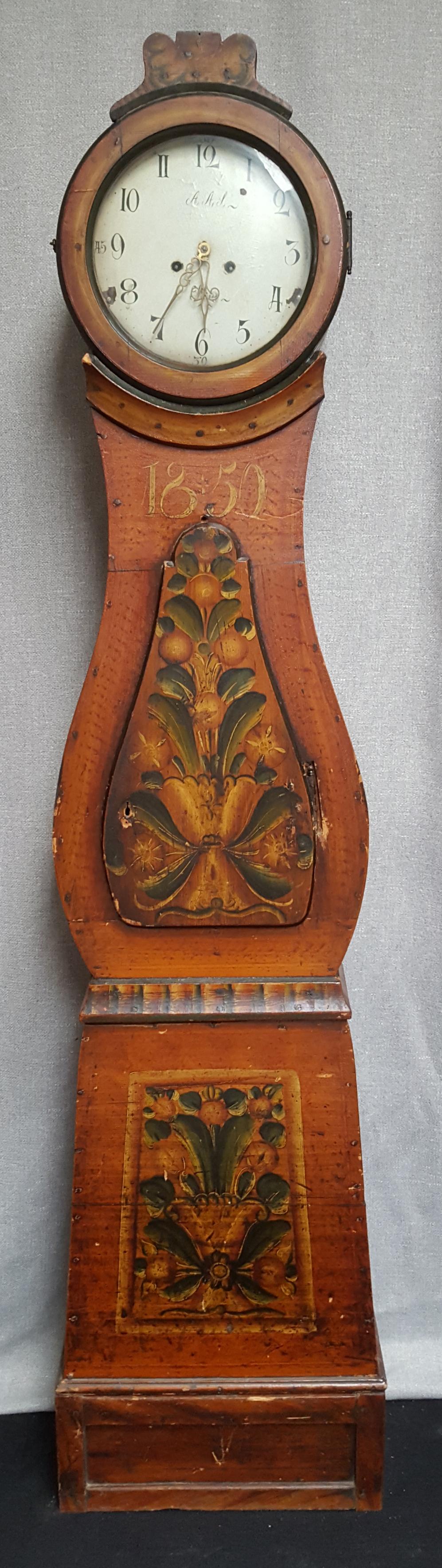 Antique Swedish Mora clock from early 1800s ( dated 1850) in probable original paint with a great country mora clock shape body and a good face with lots of detail and clean face. 

It has the Classic motifs and coloring of a traditional Swedish