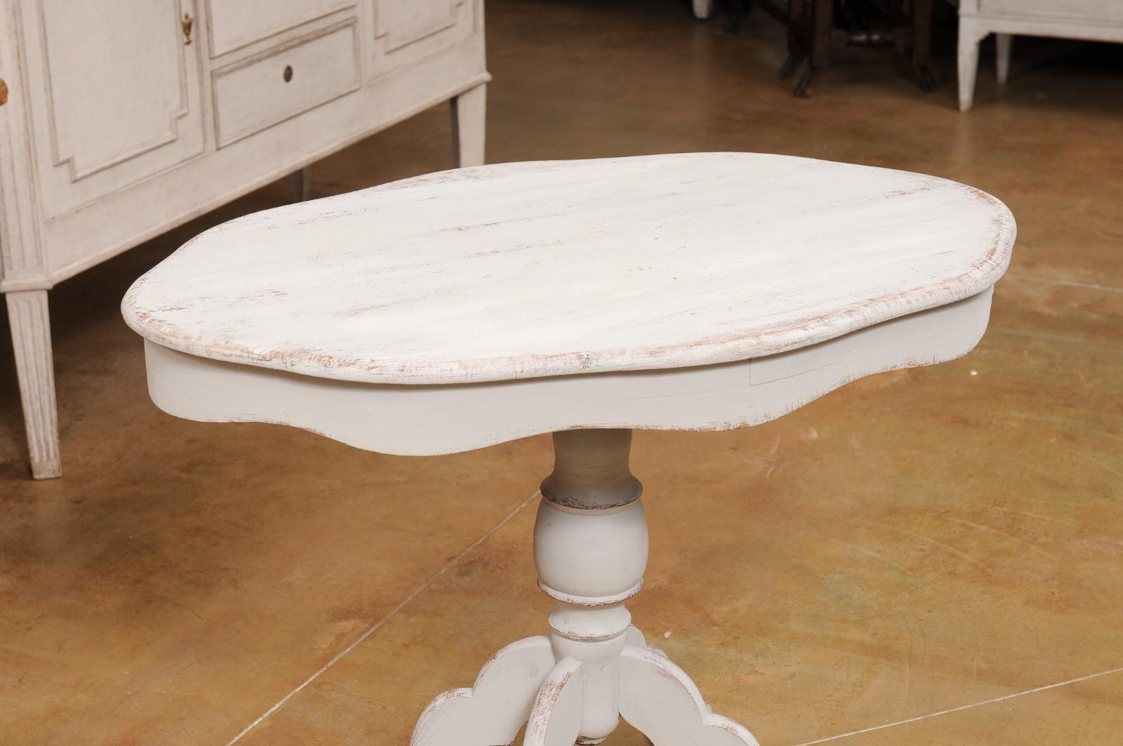Wood Swedish 1860s Painted Oval Pedestal Table with Carved Apron and Quadripod Base For Sale