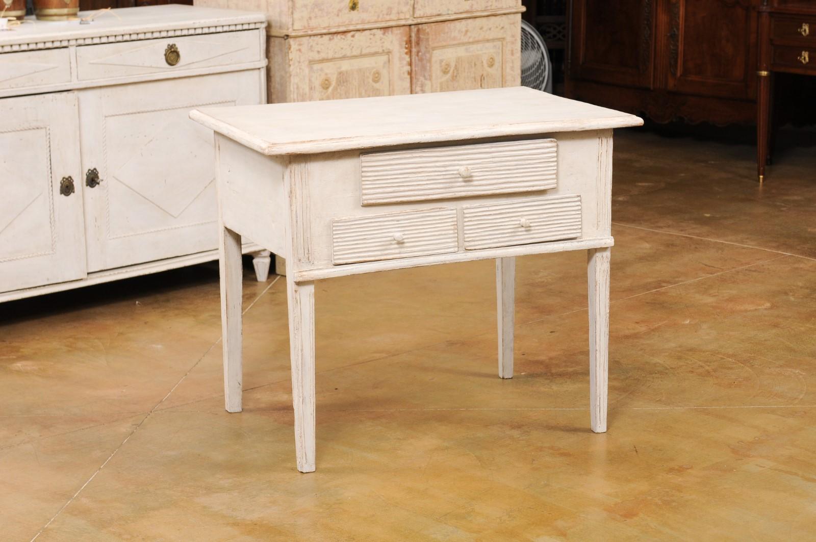 Carved Swedish 1880s Gustavian Style Painted Side Table with Three Reeded Drawers For Sale