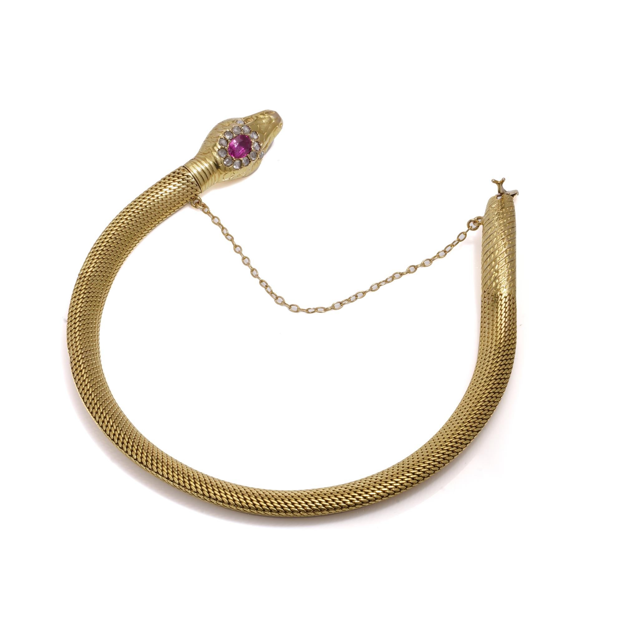 This is an antique Swedish 18kt yellow gold Ouroboros serpent hollow mesh bracelet. The snake's eyes are set with diamonds, and its head is accented with an oval ruby surrounded by rose-cut diamonds, creating a stunning cluster. The piece is