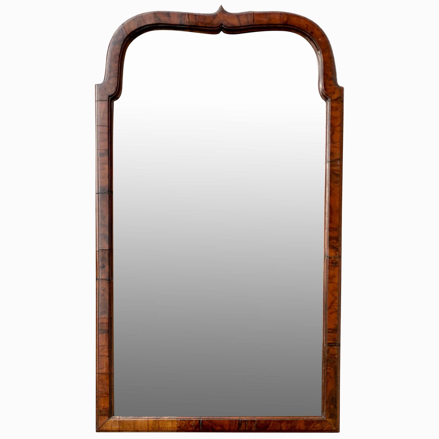 Swedish Baroque walnut veneer mirror from the castle of Rosendal outside Helsingborg in Sweden (see pictures of the castle). The castle were sold around 3 years ago and all the inventory went to auction where this mirror was bought.

The mirror is