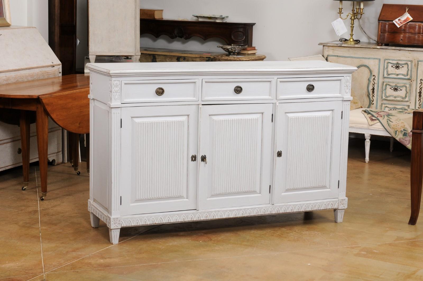 Carved Swedish 1900s Gustavian Style Painted Sideboard with Three Drawers over Doors For Sale