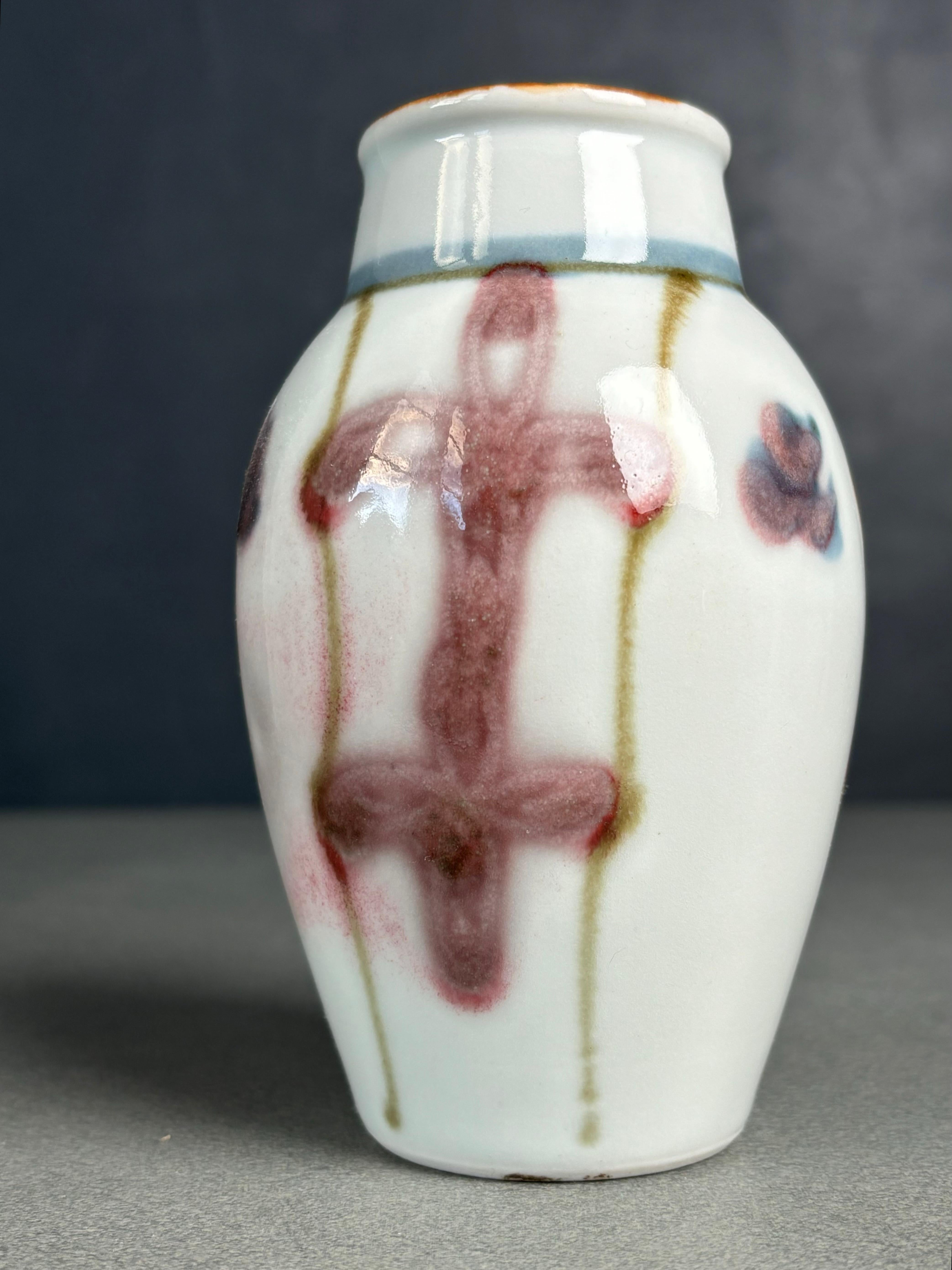 100-year old Swedish Art Nouveau vase handmade by artist Edgar Böckman in the 1920s. White, rose, magenta, spicy ochre and light blue colored lustre glaze covering the small shape with large hand-painted organic decorations.
Beautiful antique piece