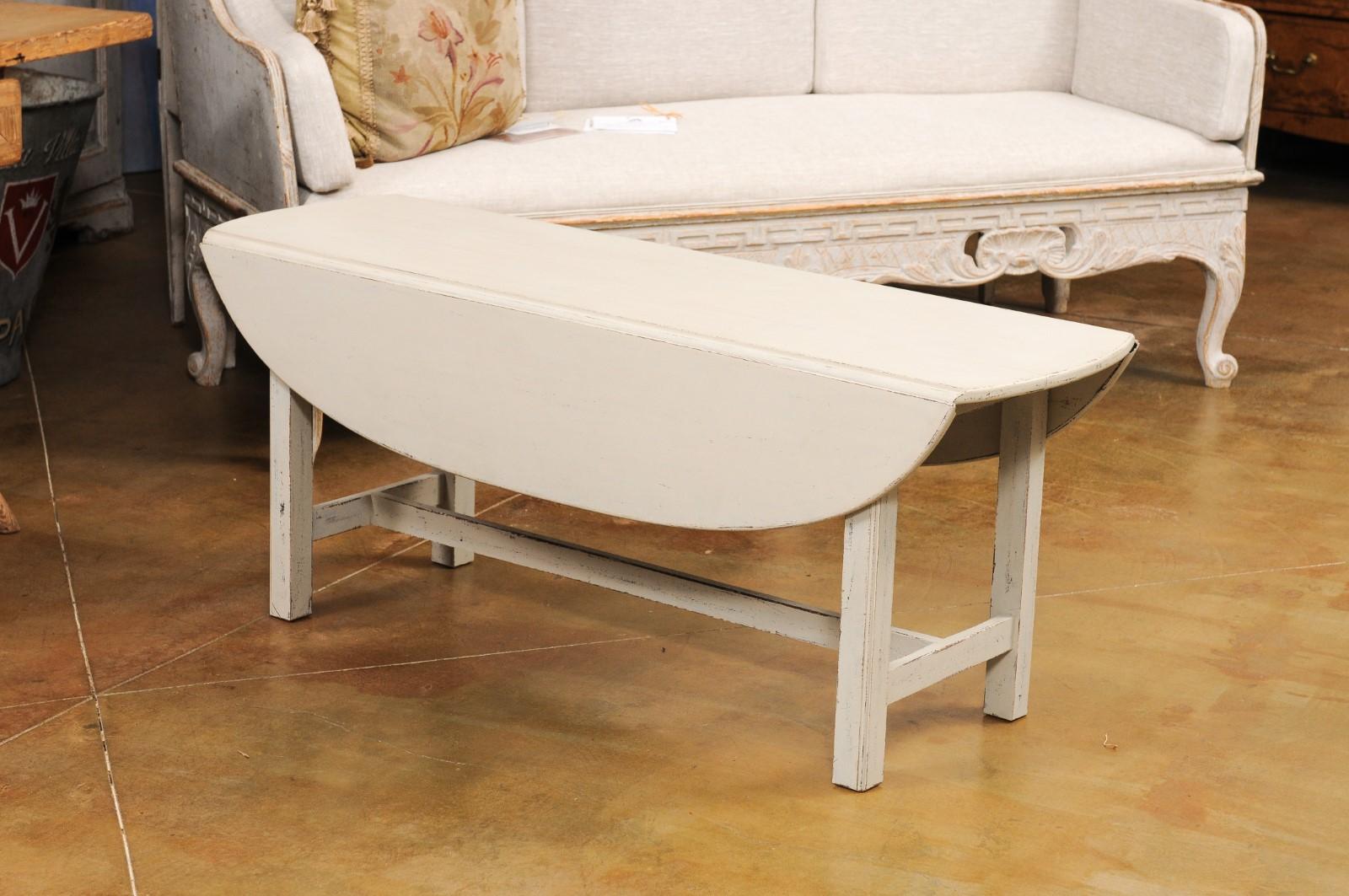Swedish 1920s Painted Drop Leaf Coffee Table with Oval Top and Stretcher In Good Condition For Sale In Atlanta, GA