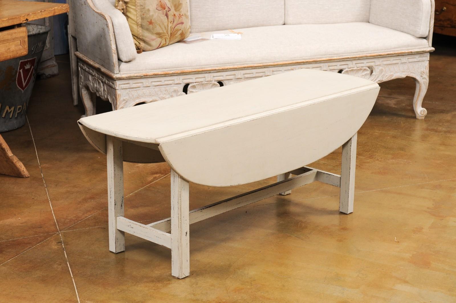 Wood Swedish 1920s Painted Drop Leaf Coffee Table with Oval Top and Stretcher For Sale