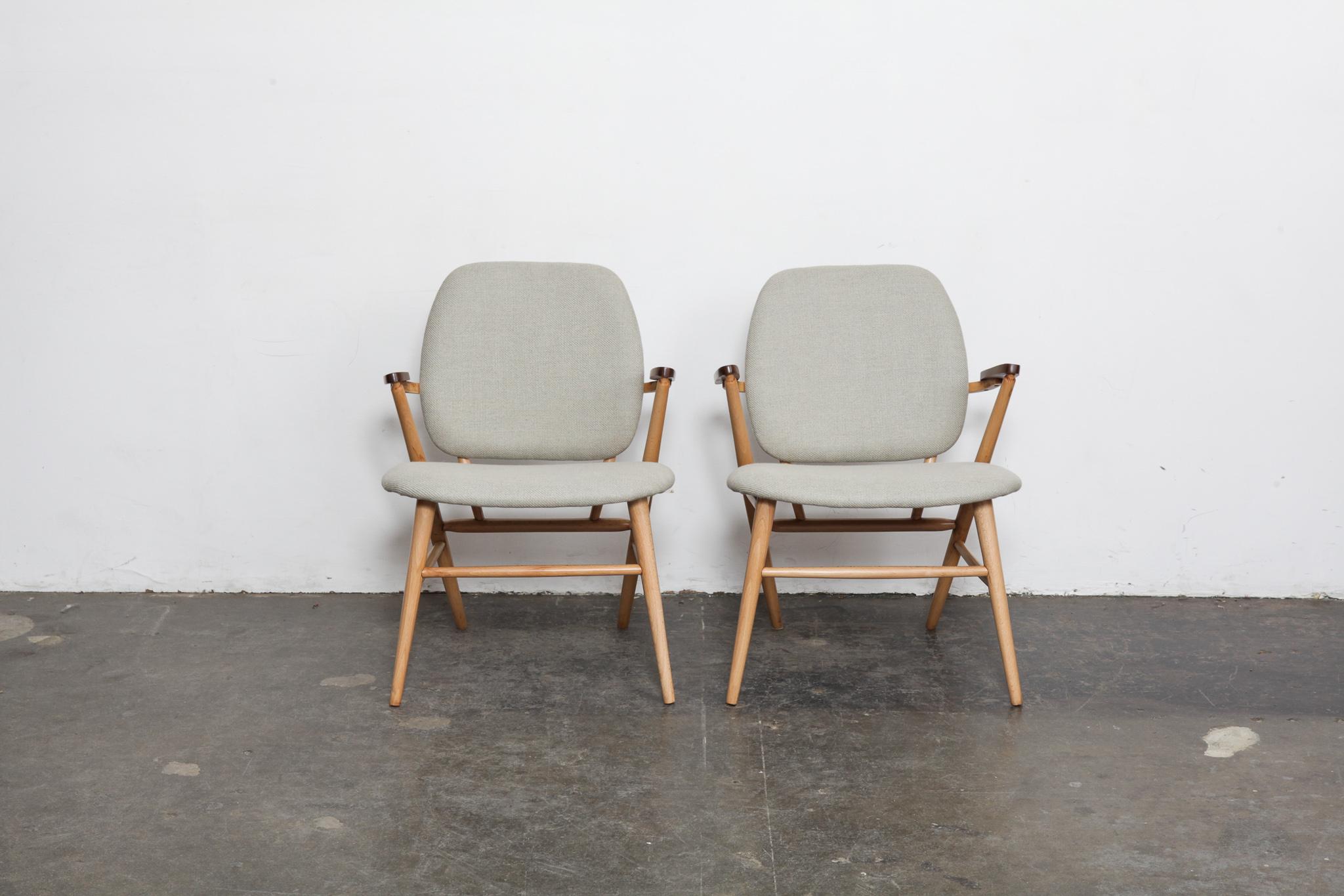 Pair of beautifully architectural side chairs made from solid beech frames + teak arms newly refinished in lacquer with fabric seat and back cushions newly upholstered in a Belgian woven linen fabric, Sweden, 1950s.