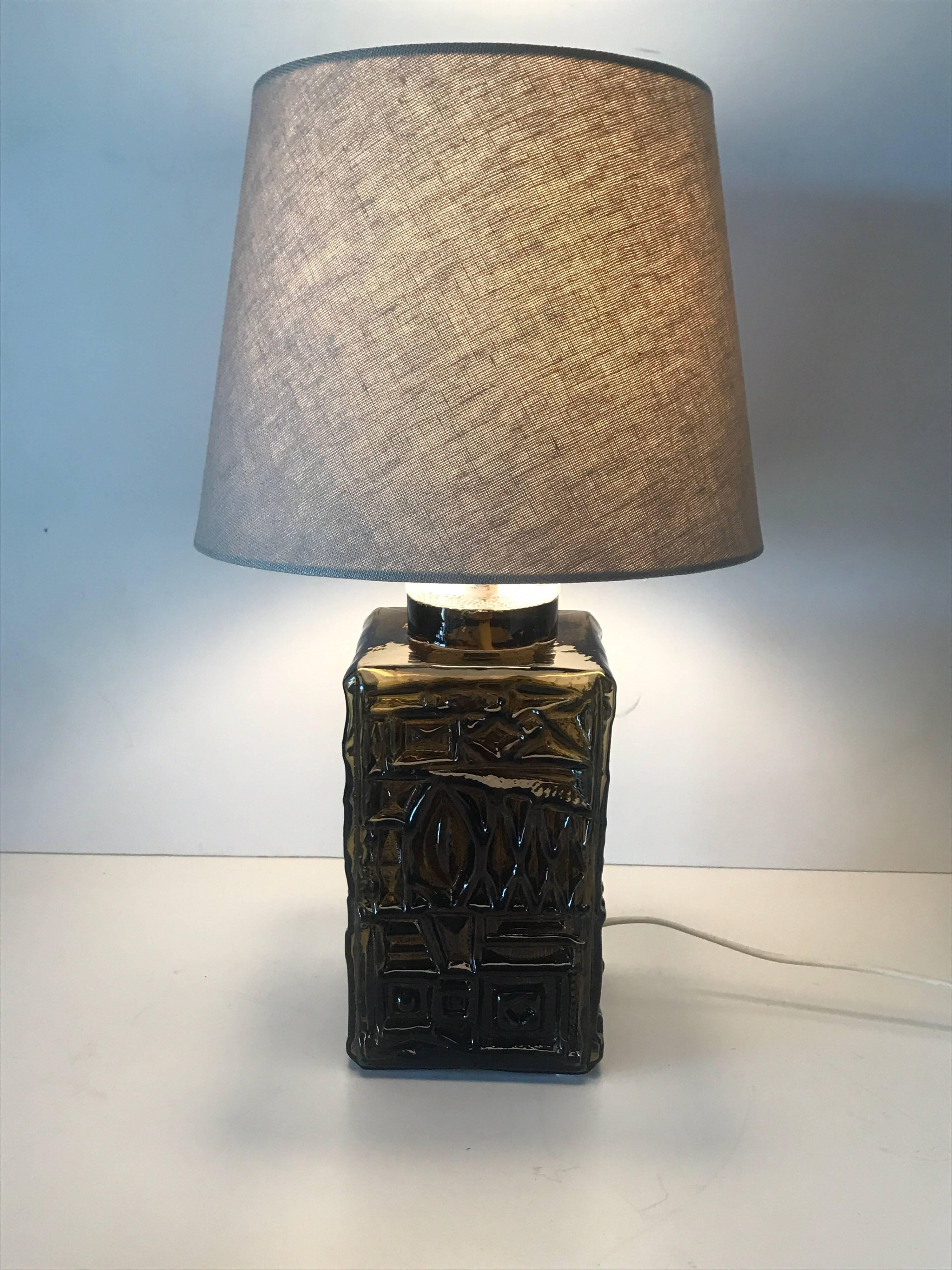 Swedish, 1960 Pukeberg squareshaped Art Glass table lamp.
A rare and beautifully bronze coloured art glass table lamp, made at Pukeberg glass factory. 
The lamp is in a great condition without any cracks, chips or damages. It measures 43 cm