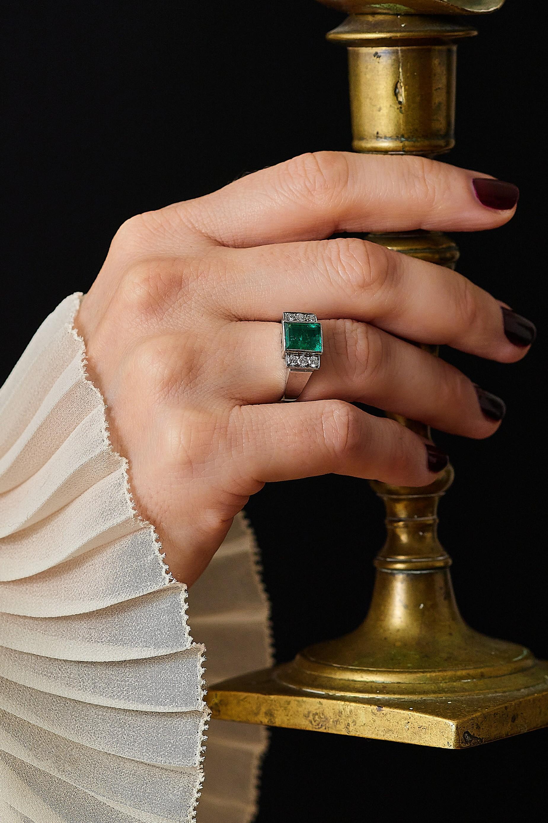 Swedish 1960s 1.75ct emerald ring. 

The emerald has a nice deep lush green color. To each side are three 0.05ct brilliant cut diamonds. The ring is crafted in 18karat white gold. Hallmarked Gustaf Dahlgren & co, Malmö 1960 

Gross weight: 6.5gram